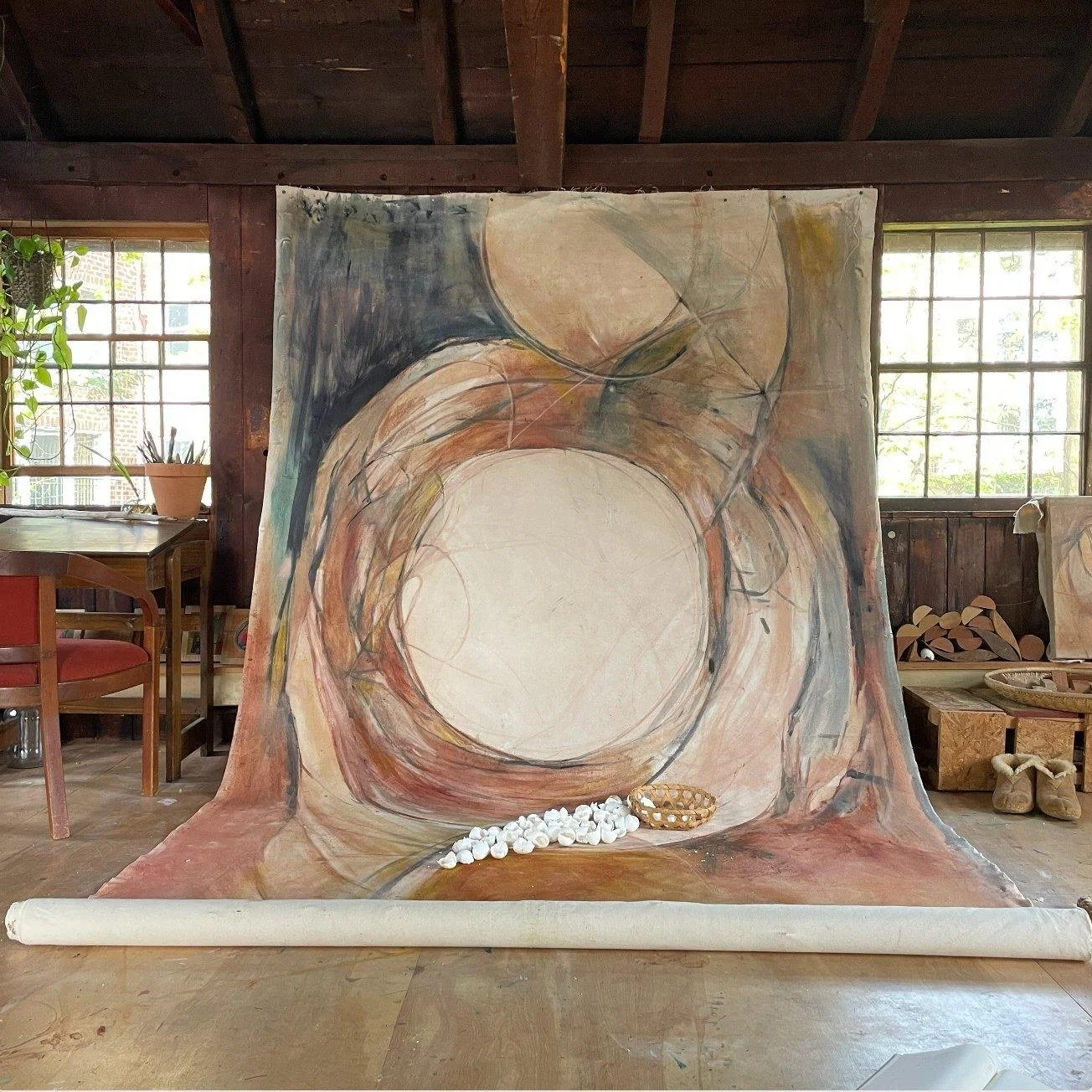 Instar series by Eva Zasloff, large natural-pigment painting on canvas hanging in the Barn at Schwamb Mill, with eggshells on the floor