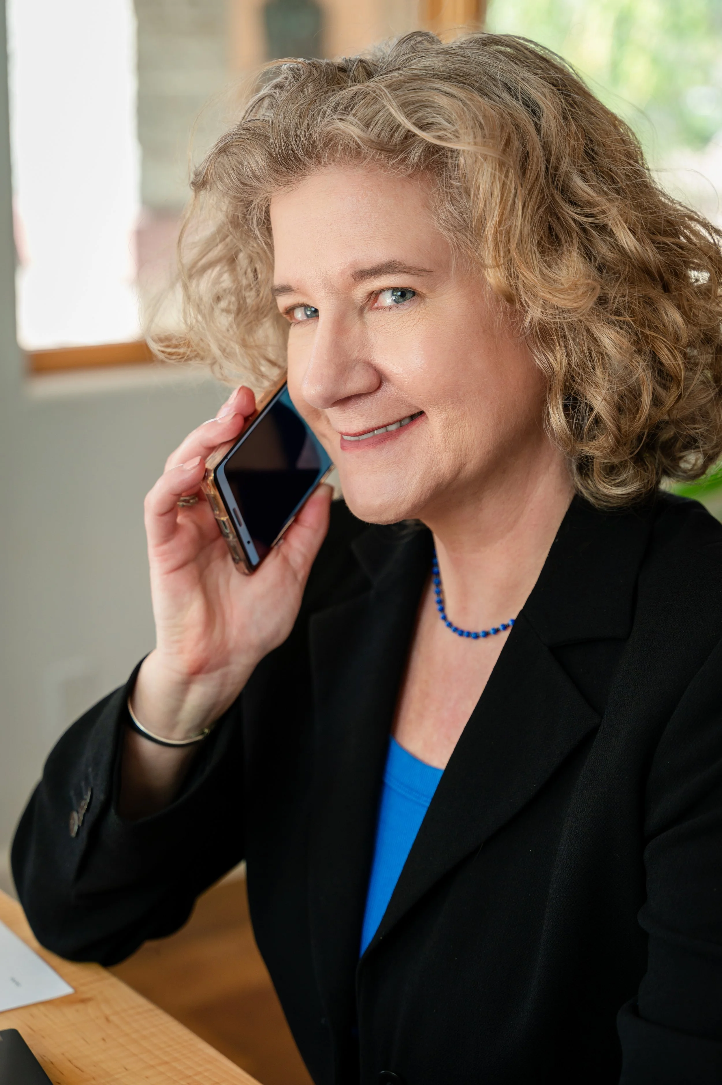 Photo of Tania Tong  holding a phone