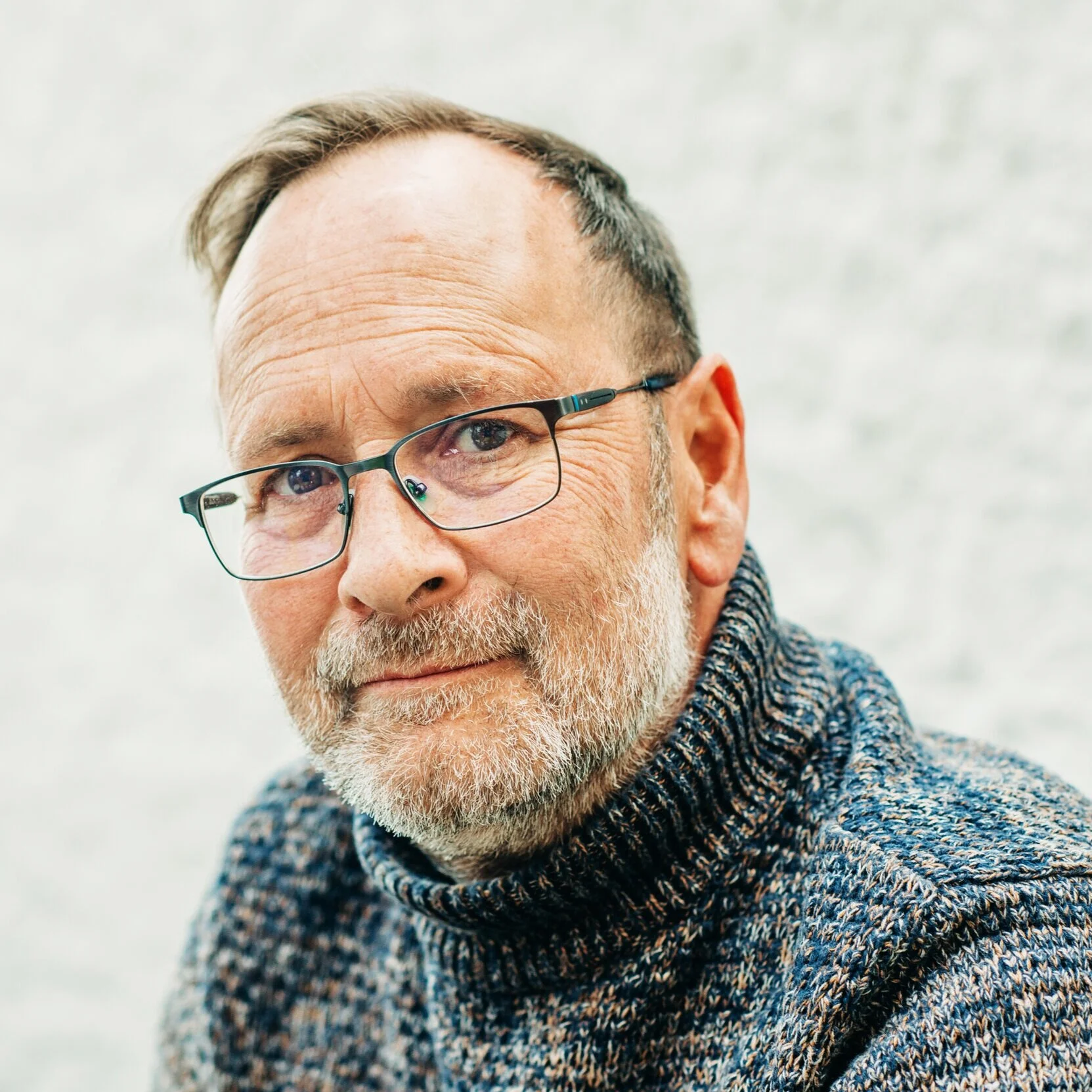 Older man turtleneck sweater stock image.jpeg
