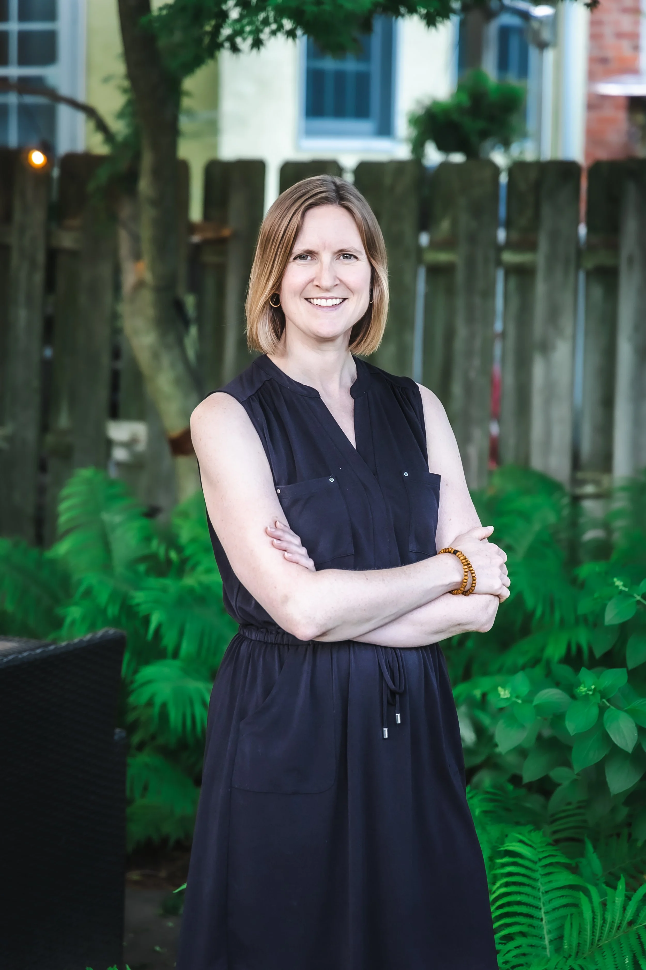 Image of Emily Browning, LCSW, with greenery in the background.
