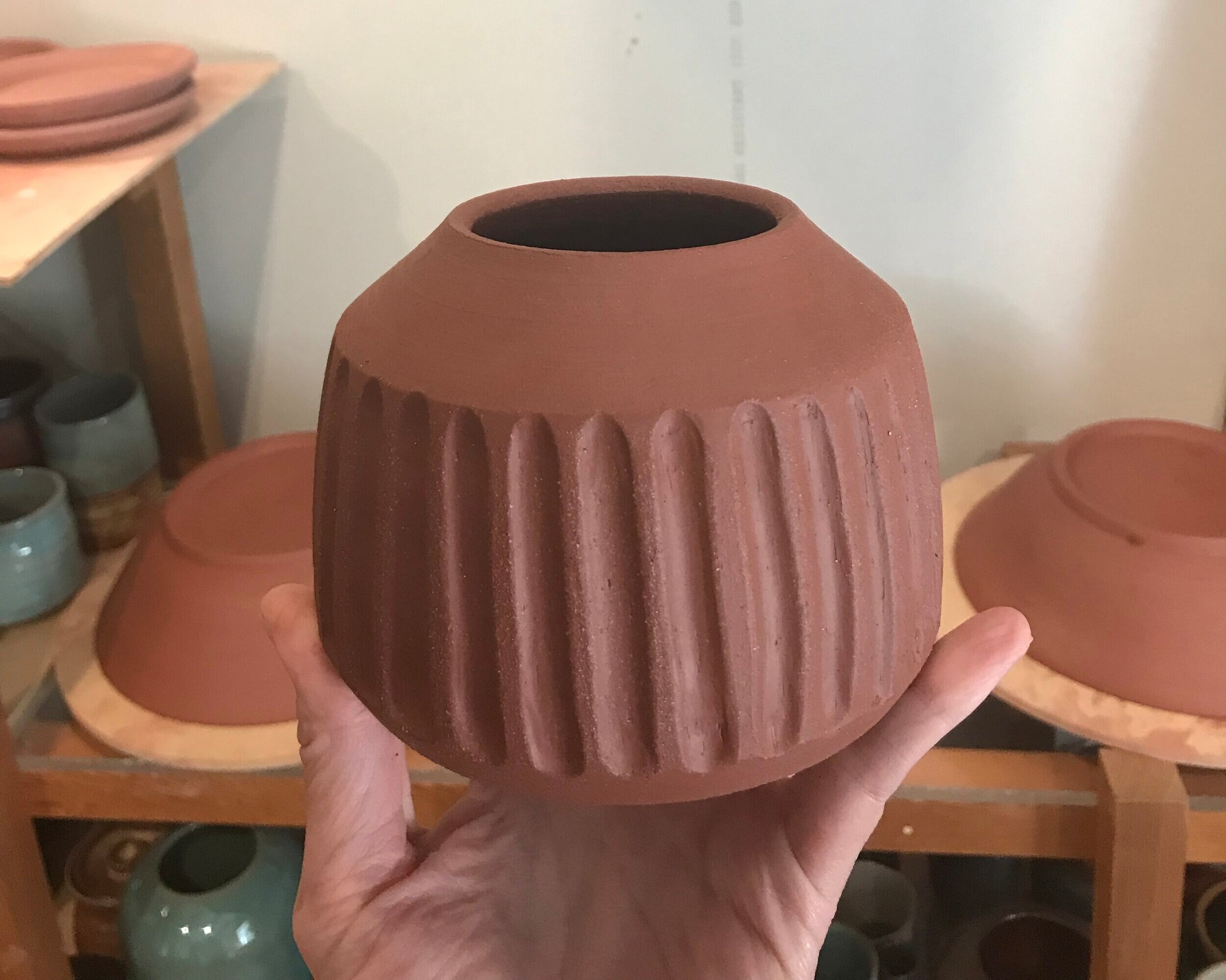 This vase was trimmed to tidy up the bottom, then hand-carved with a trimming tool.