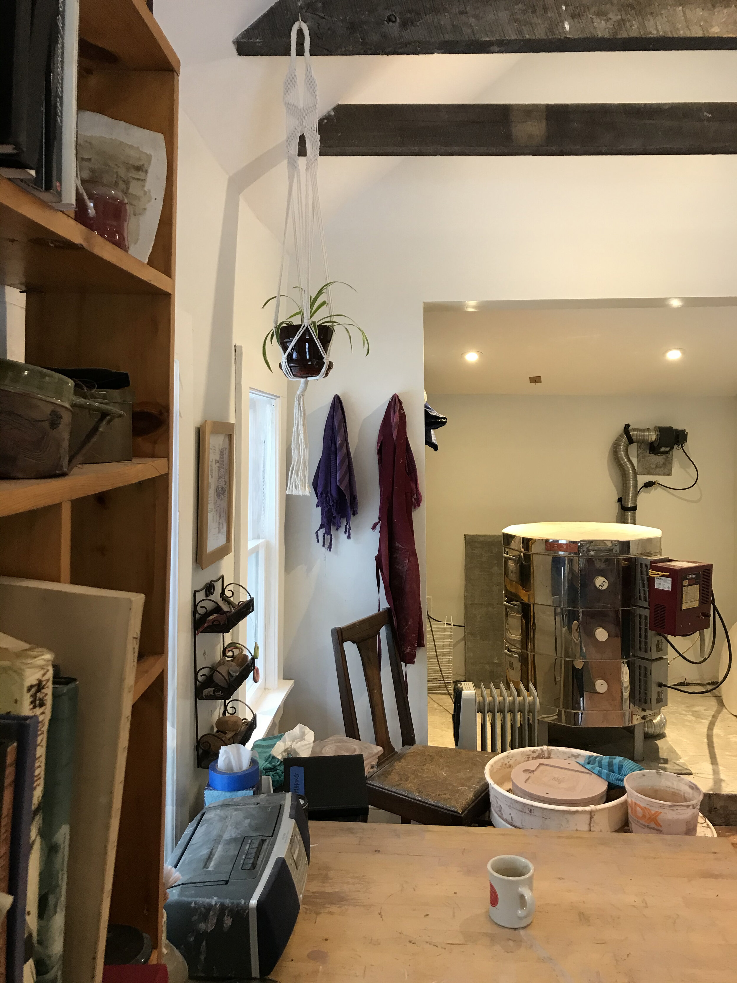 A view of my studio. I use a Shimpo wheel and an L&L electric kiln.