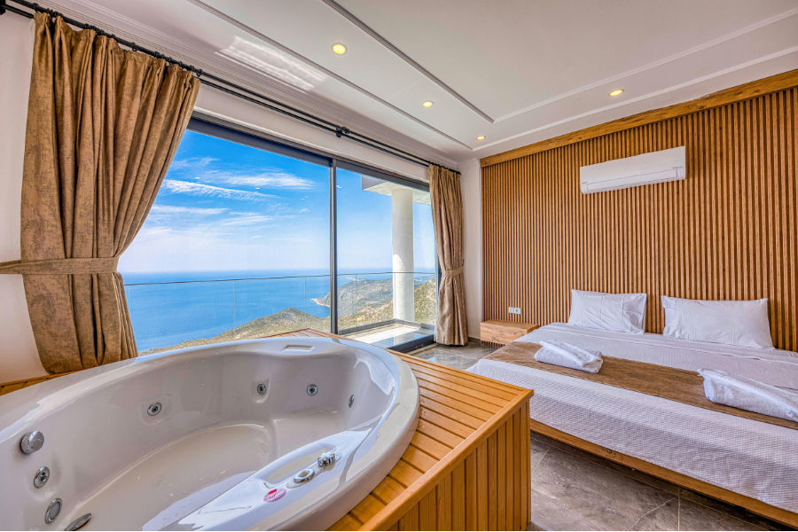 hotel room with a sea view and a bath tub