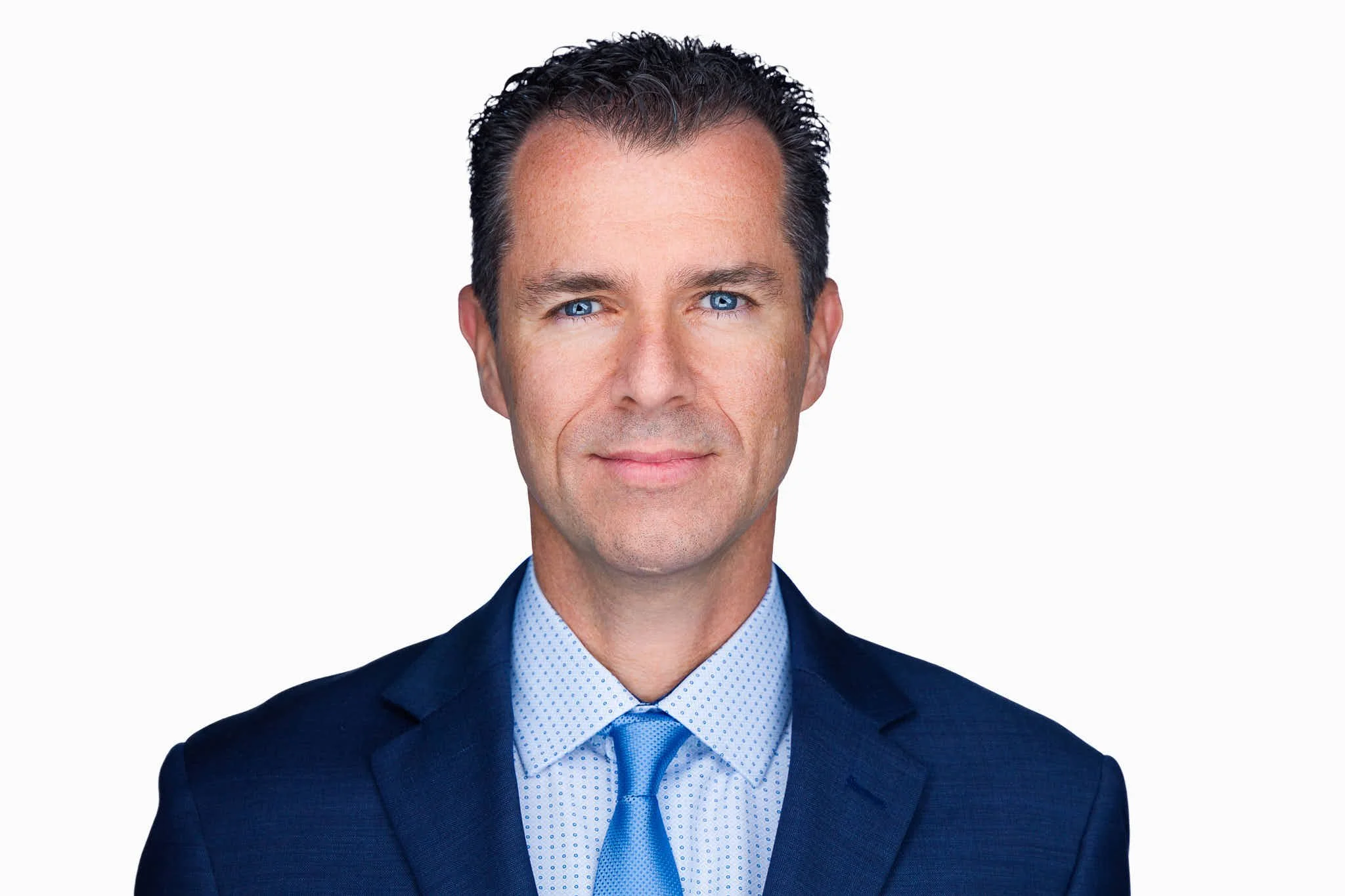 LinkedIn headshot showing professional clothing in classic neutral colors