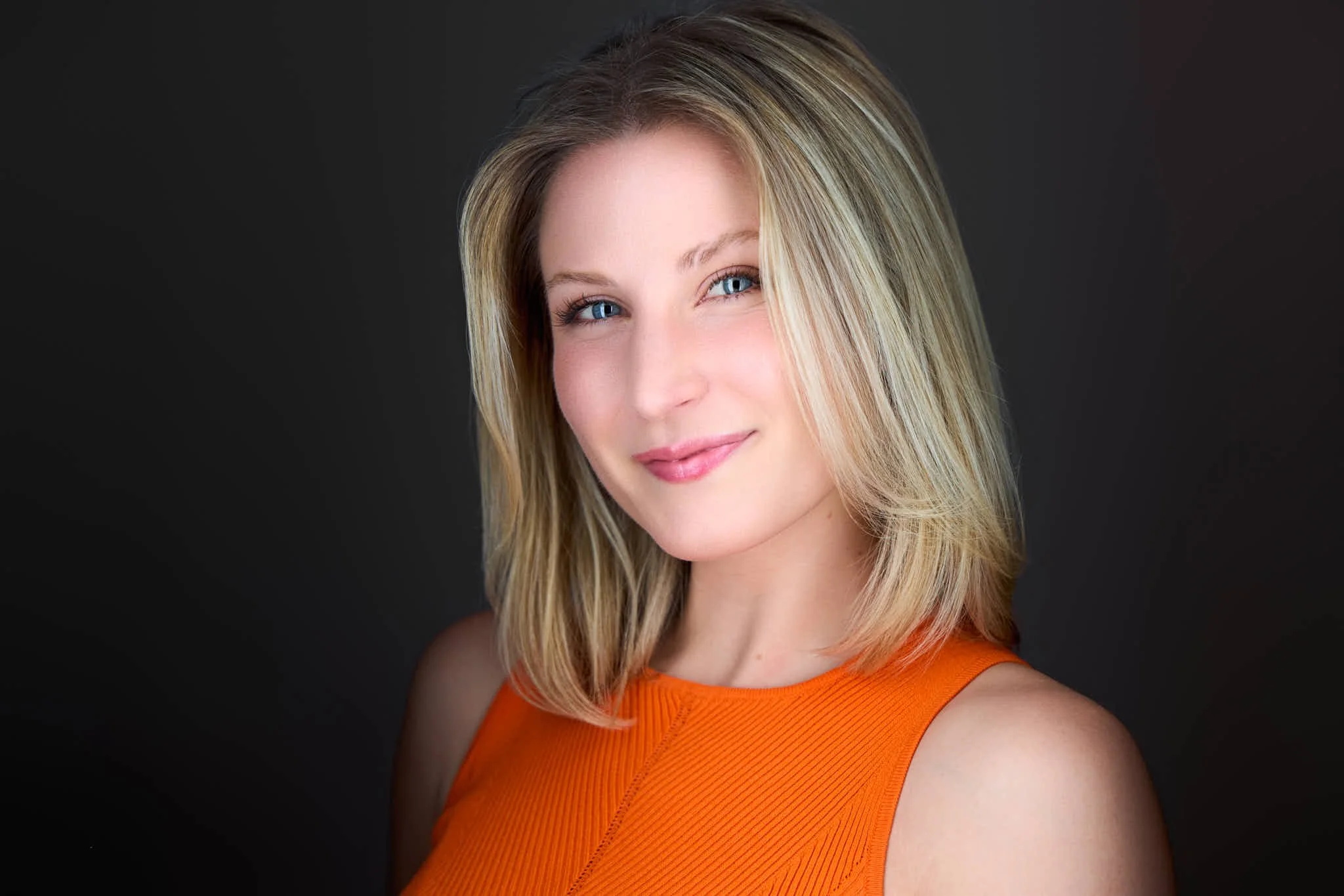 LinkedIn headshot with a natural, confident and approachable expression