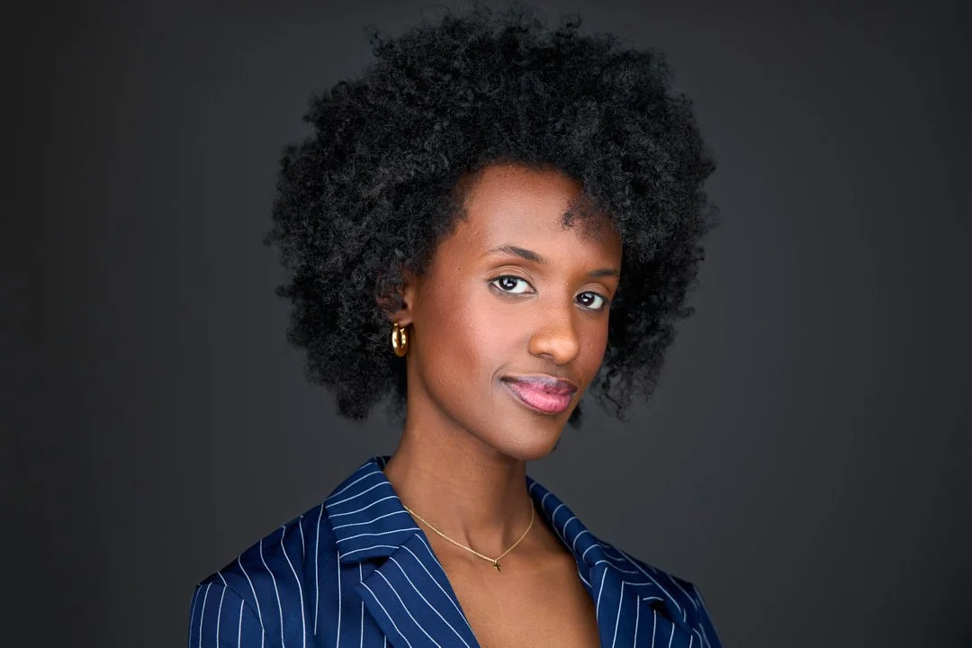 professional headshots clothing example of a woman with a navy blue suit