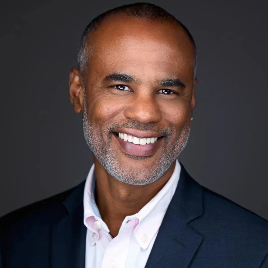 Photoshoot for LinkedIn profile with a professional headshot of a man in a navy blue suit