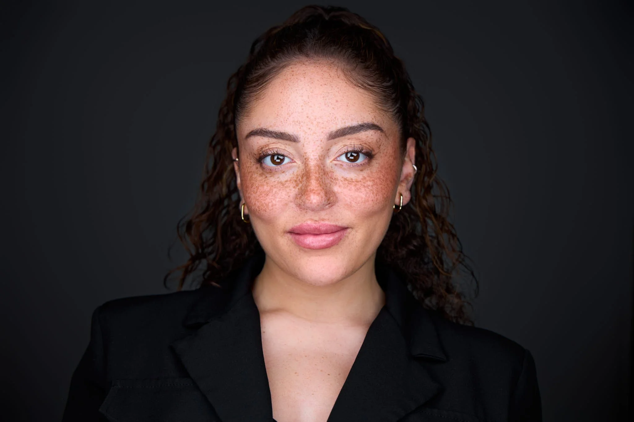 professional headshot of a banker with a black suit