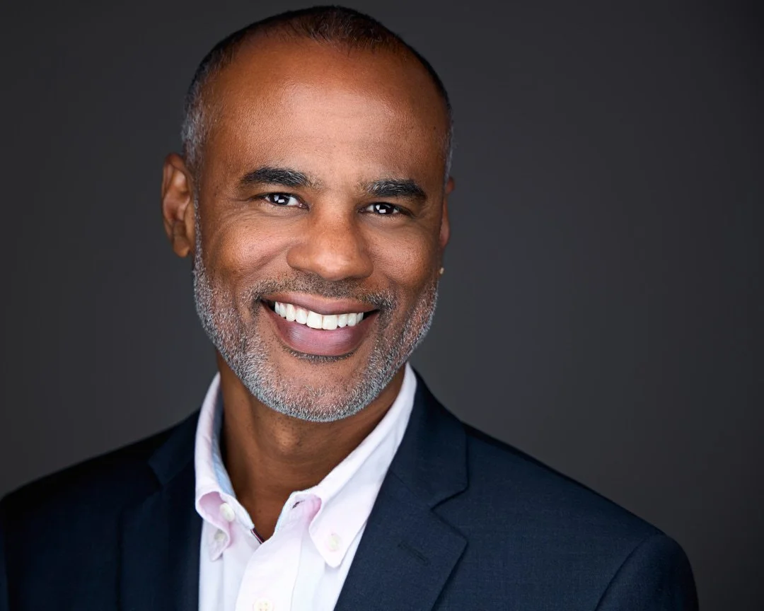 professional corporate Headshot of an professional banker with a warm smile