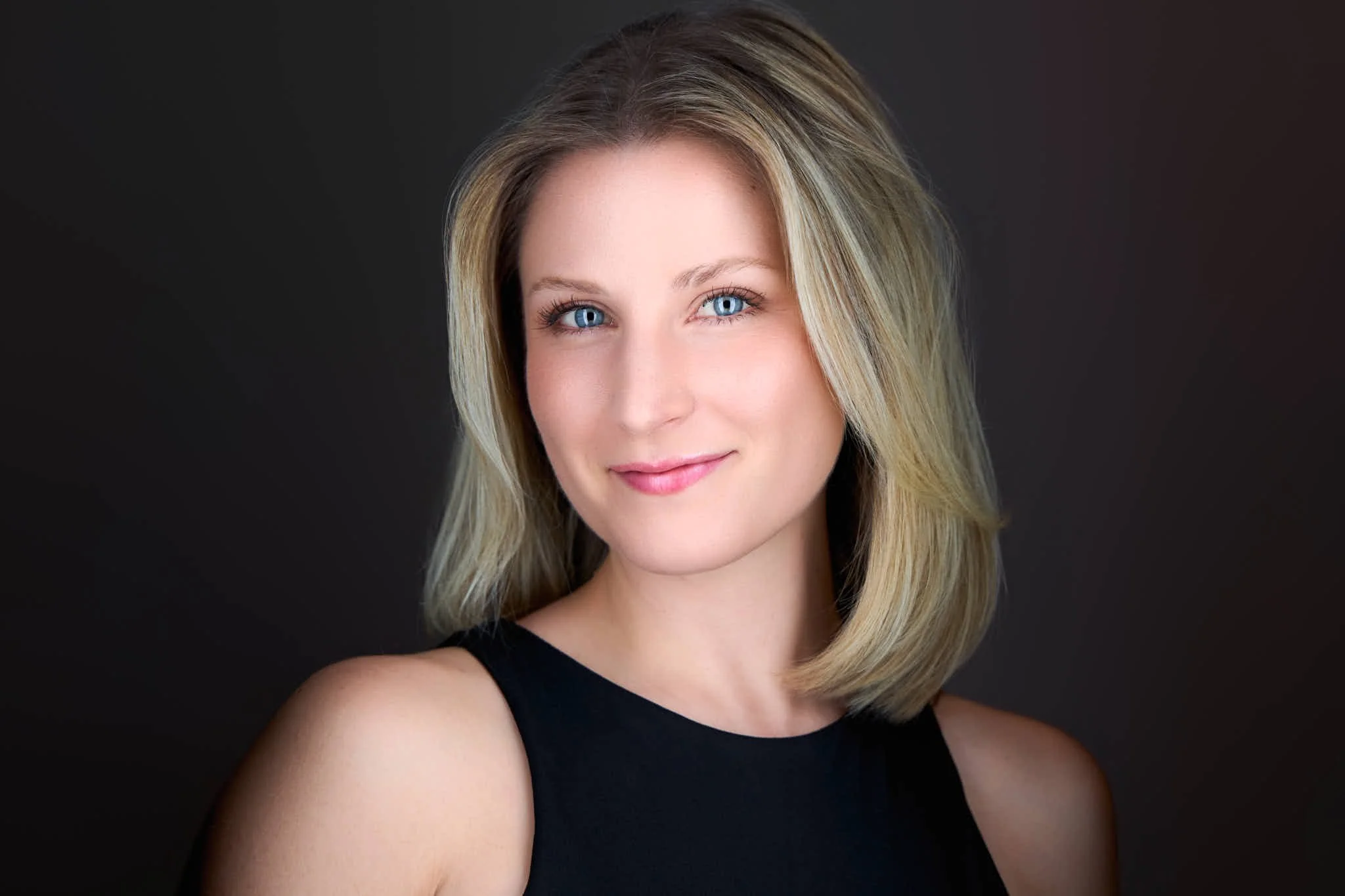 professional headshot of a banker with a black top