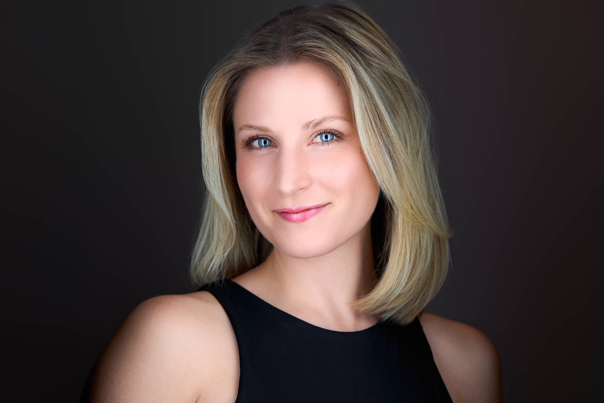 Woman posing for a professional photoshoot for LinkedIn profile