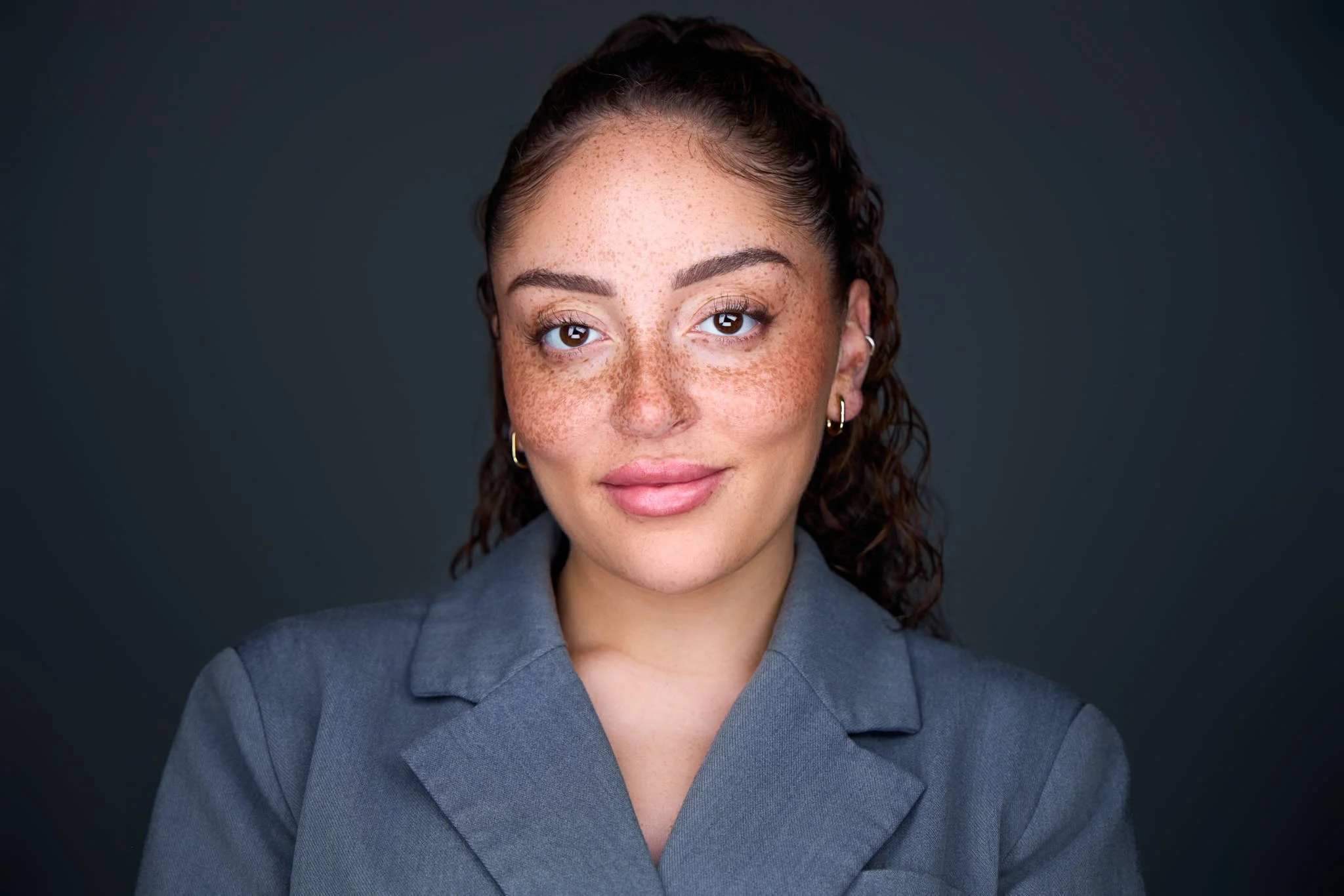 professional headshot of a banker with a grey suit