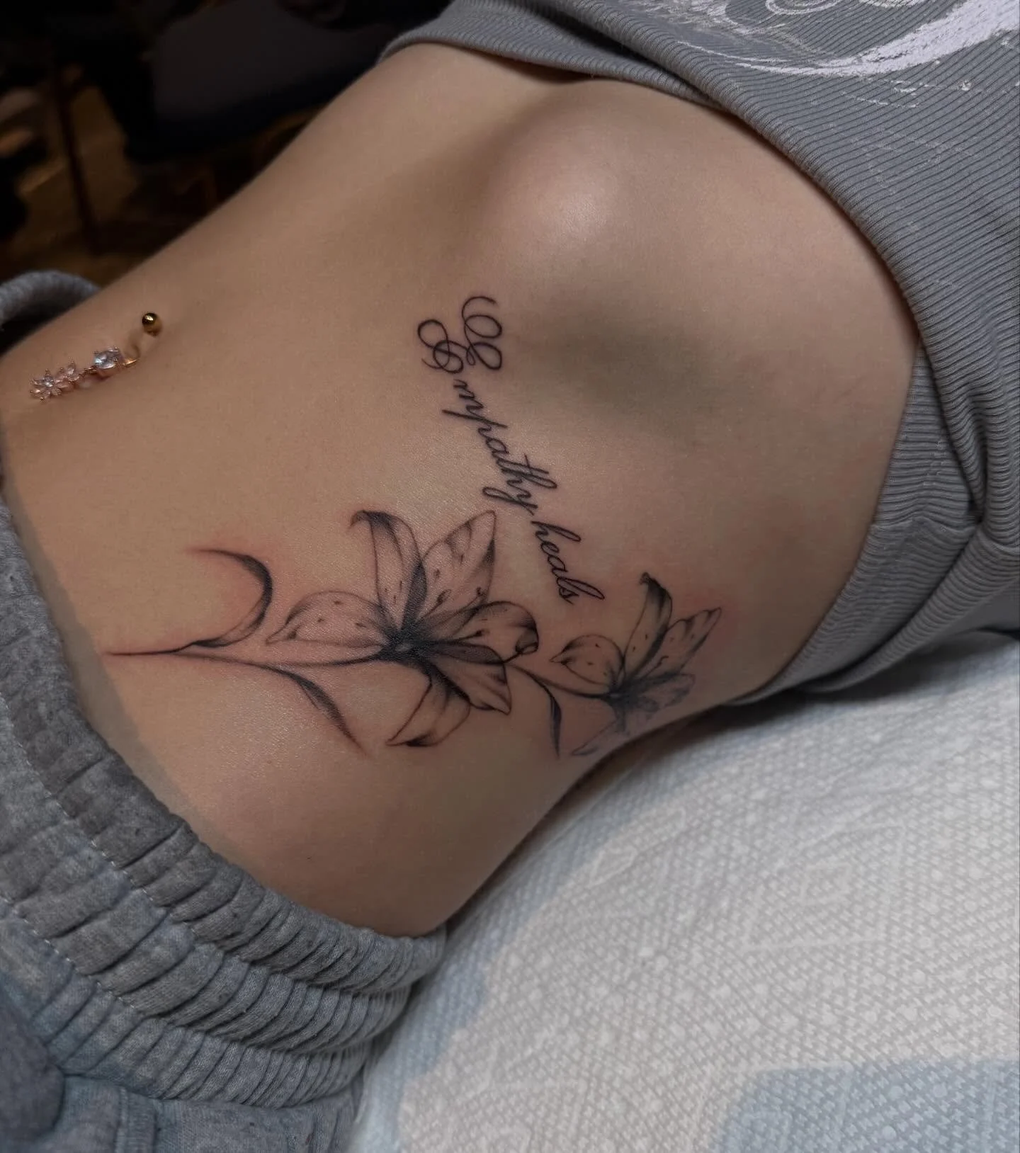 bloom quietly. 
i had the opportunity to give victoria her first tattoo at the motorcity convention. thank you endlessly for the trust. 
-
#blackandgreytattoo #finelinefloraltattoo #tattoos #tattooartists #michigantattooartist