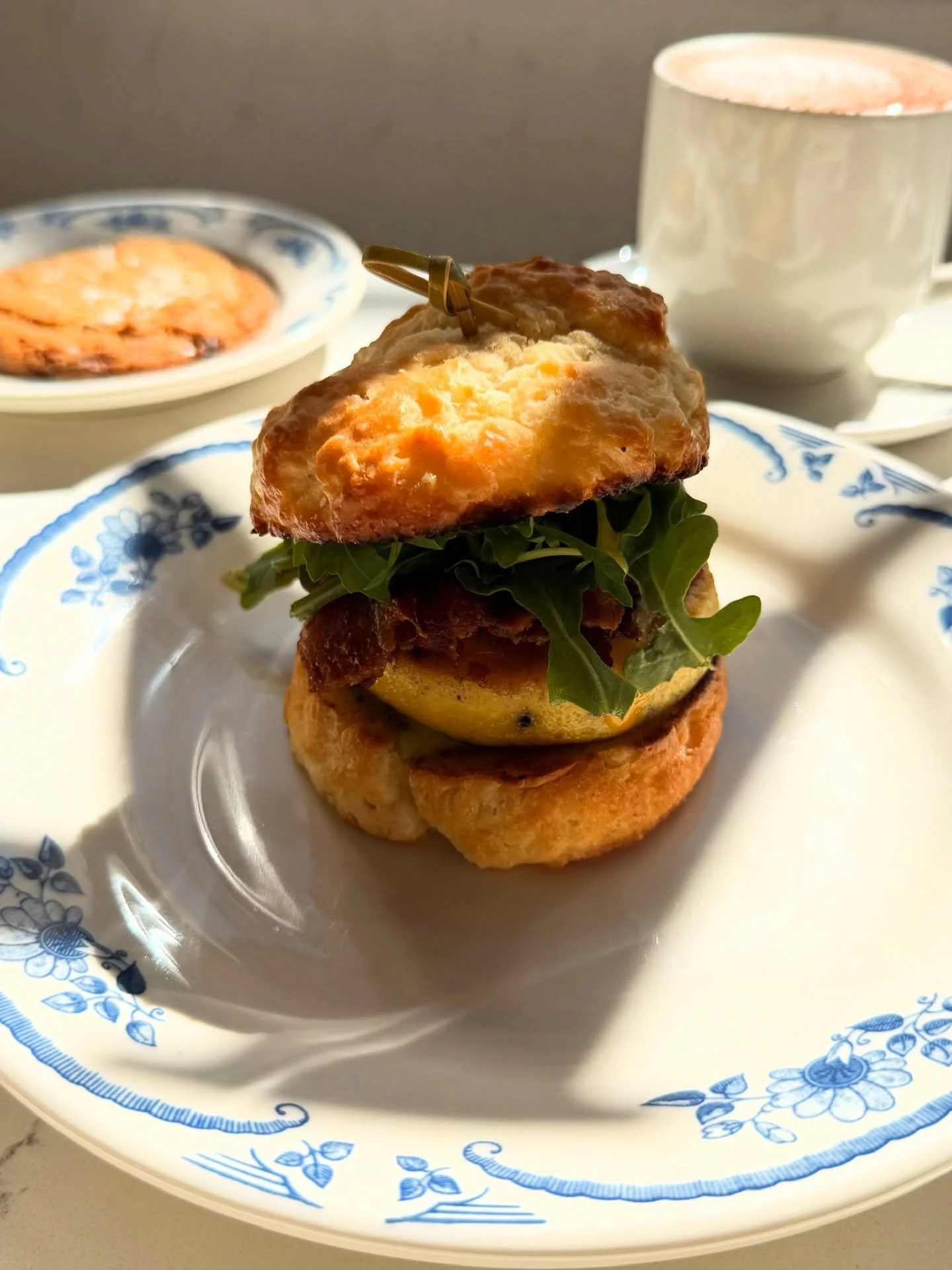 Breakfast sandwich on a scratch made buttermilk biscuit ✅ 

Fluffy egg souffl&eacute;, roasted tomatoes, cheese, fresh greens, &amp; herbed dijonaise. Add bacon if ya like it. Also available on a @willowbendenglishmuffinco chive English muffin!

📷: 