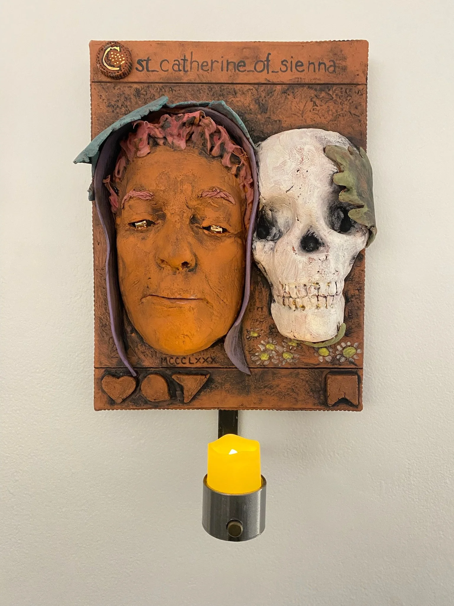 St. Catherine of Siena: 
Doctor of the Church and Protector from Sudden Death (Italian 1347-1380) 
I represent St. Catherine with a skull reflecting life/death and the seriousness of her studies. She is one of four female doctors of the church.