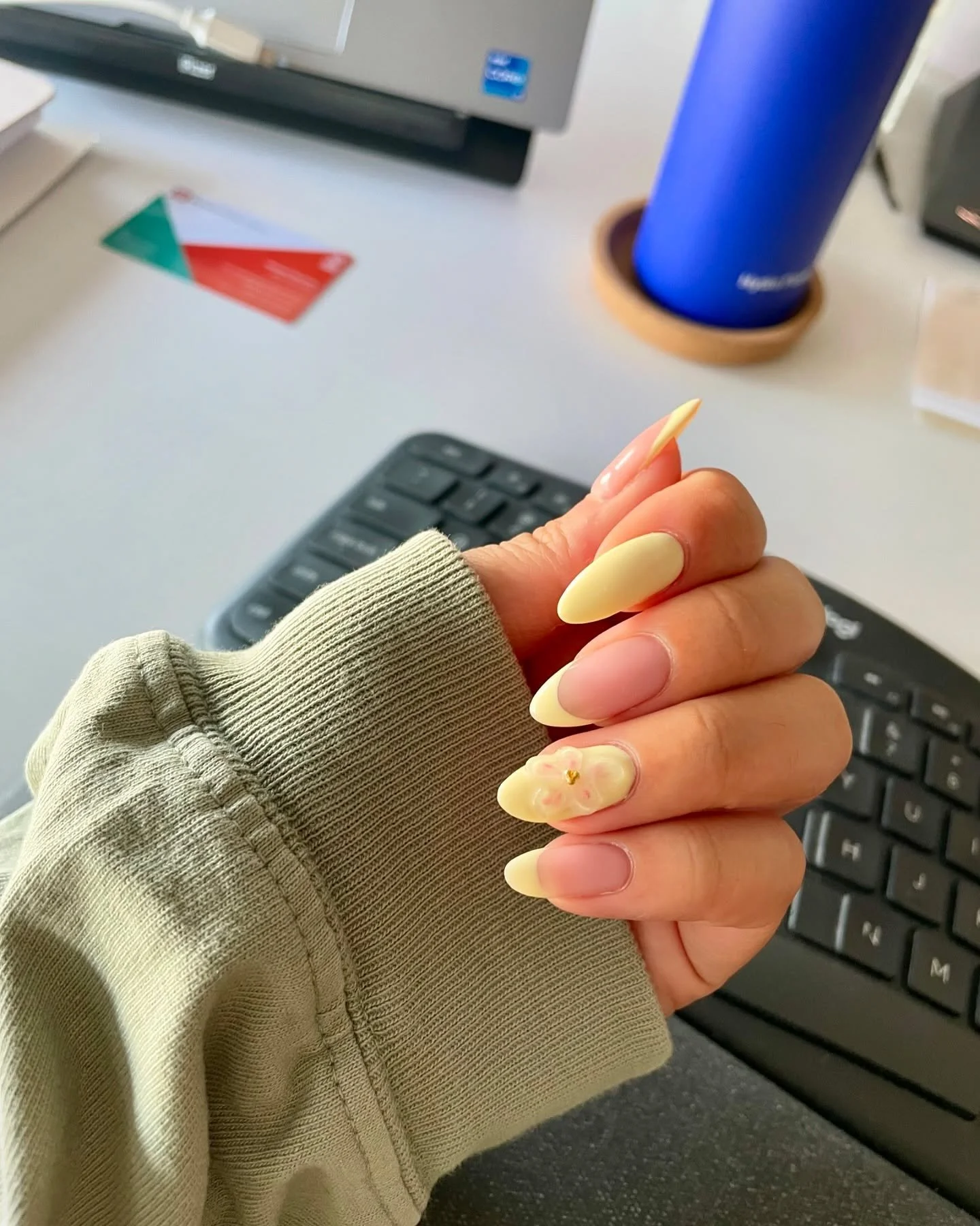 💅🏻🌼👩🏻&zwj;💻 Some of my simple work from home essentials: yellow French tips, 3D nail art, my ergonomic keyboard, my library card (creature comforts!!!), and water bottle.

Mani artist: @nailsmonicabui 
Mani design inspo: @melibeautylounge1