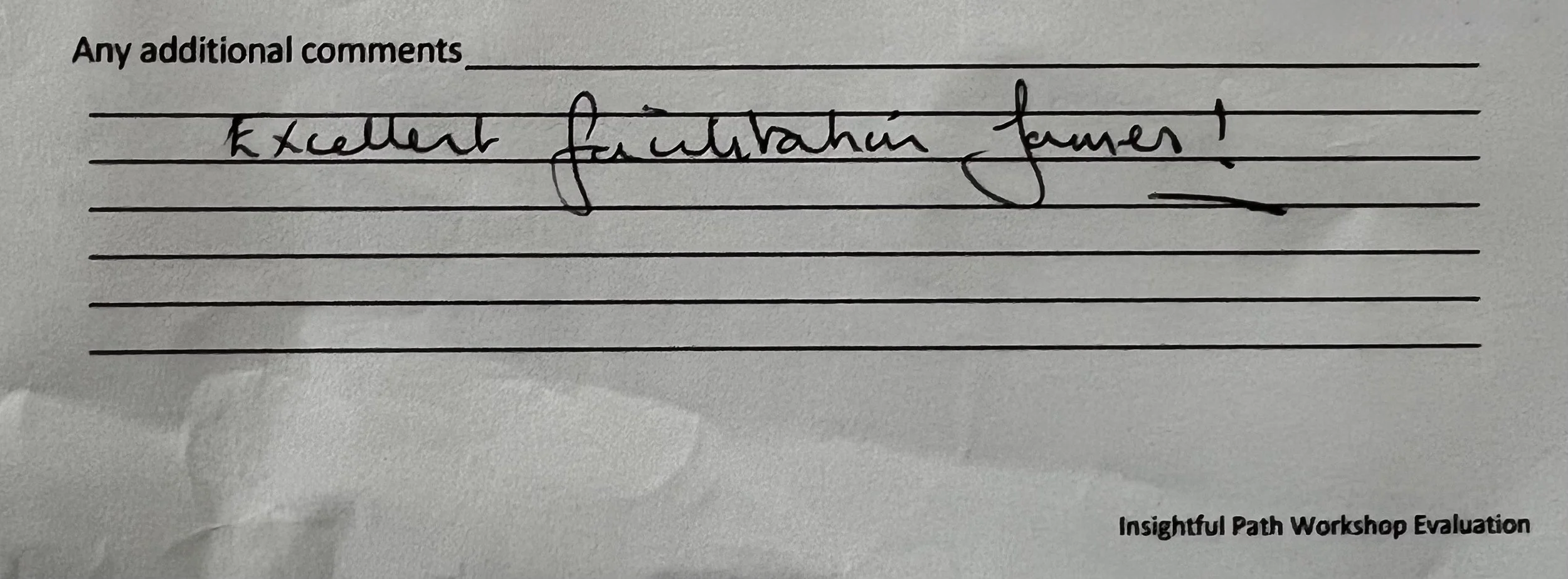 A paper with the handwritten words "Excellent illustration framework" and a printed note at the bottom right corner reading "Insightful Path Workshop Evaluation."