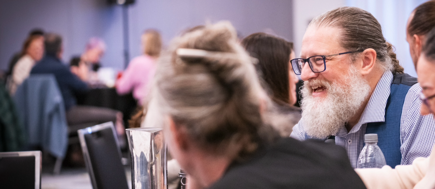 James leading a facilitated group discussion, demonstrating presence, relational awareness, and ethical facilitation practice