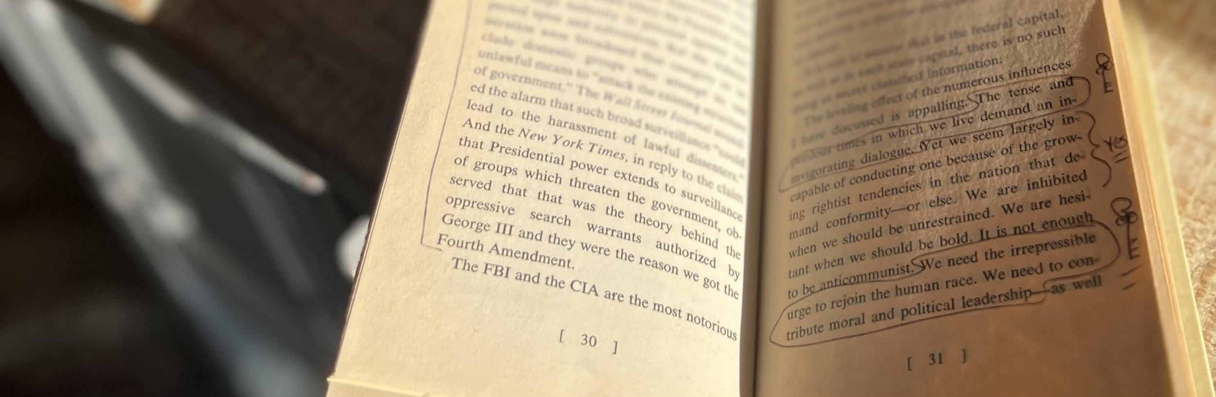 Image of William O. Douglas's Points of Rebellion, opened showing writing in margins, and the message 'the tens and perilous times in which we live demand an invigorating dialogue'