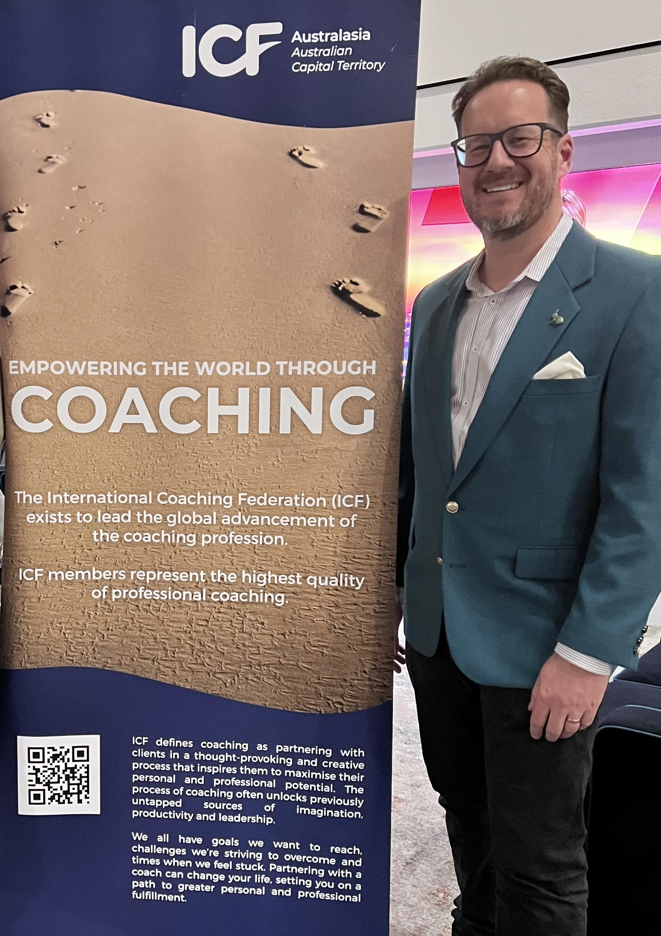 An image of Brendan standing by the International Coaching Federation's AustralAsia's ACT Coaching Connect gathering held on 8 July 2025.