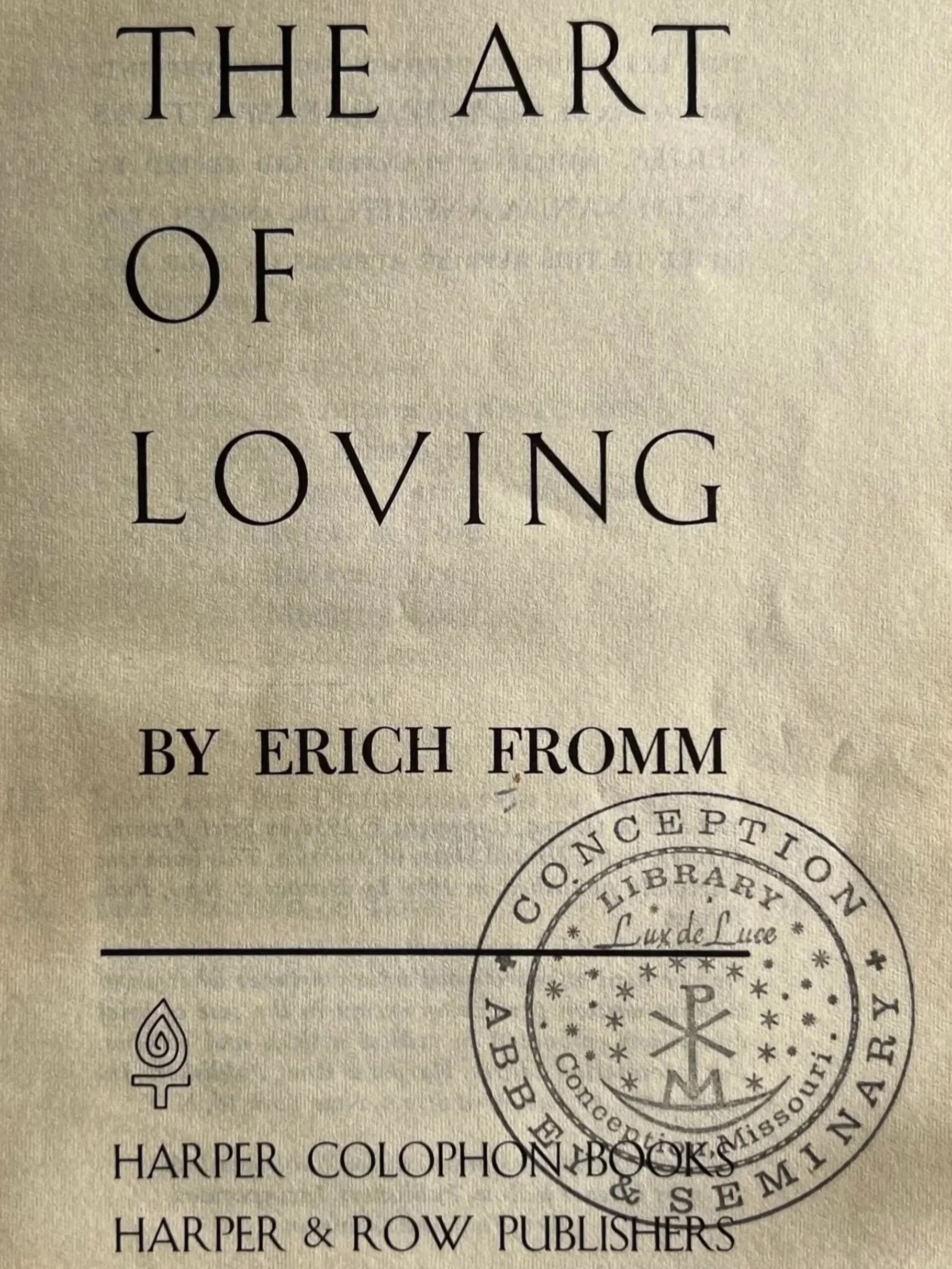 Title page of The Art of Loving stamped with the Conception Abbey and Seminary Library seal.