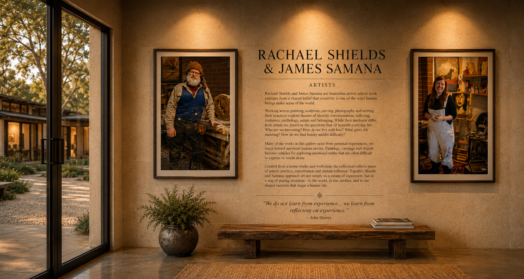 Gallery wall with two framed photographs of artists Rachael Shields and James Samana, along with a text description and quote, inside an art exhibit space near a glass door and potted plant.