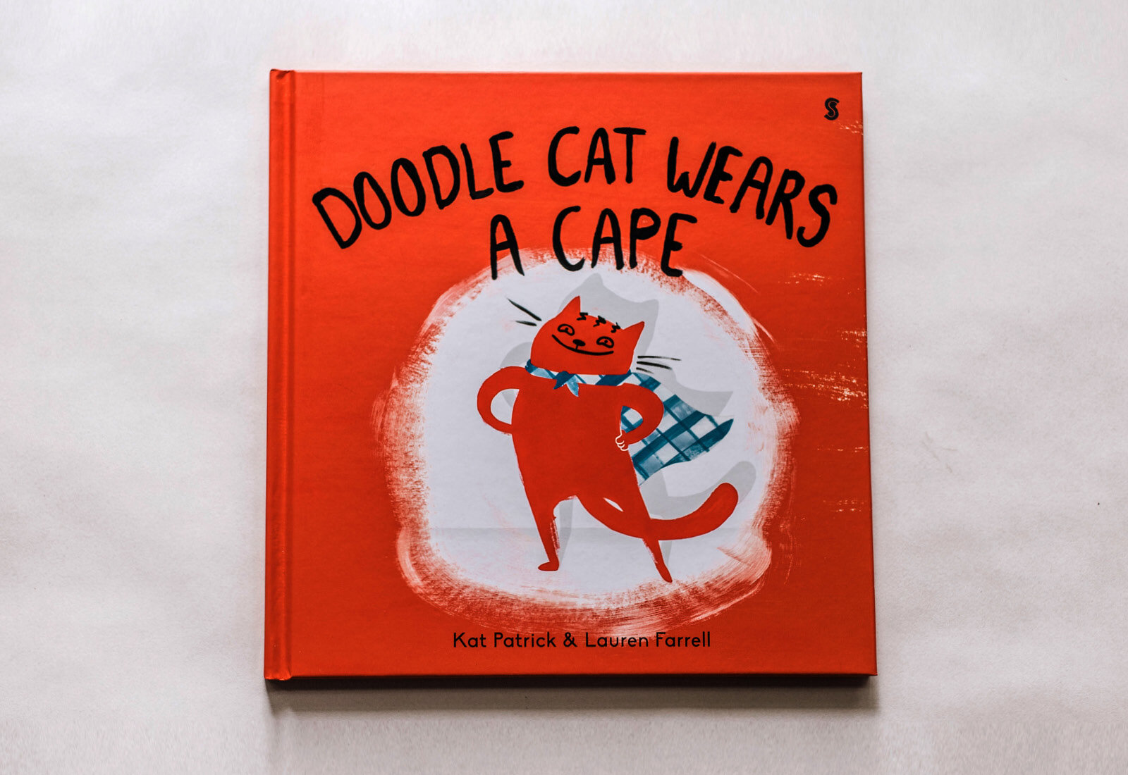 doodle-cat-wears-a-cape-spreads-.jpg