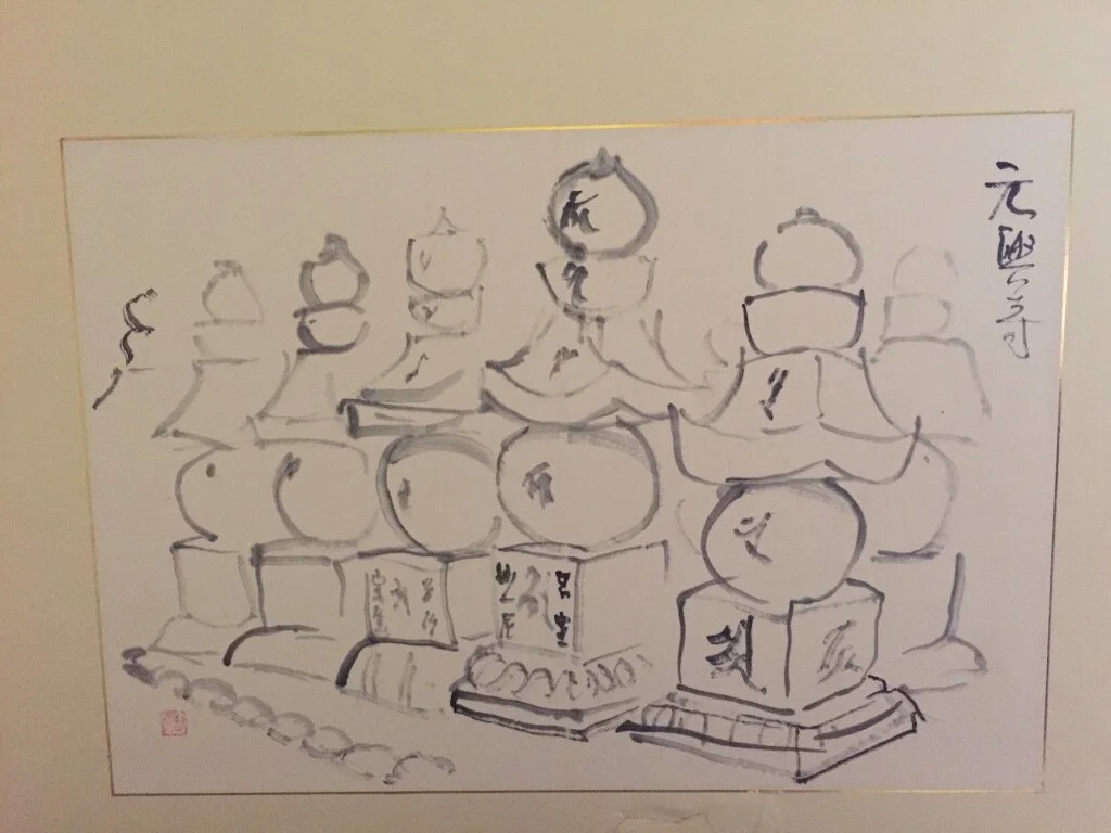 Line drawing of multiple figures sitting cross-legged in meditation, with some holding books or scrolls, and a few having halos or crowns above their heads.