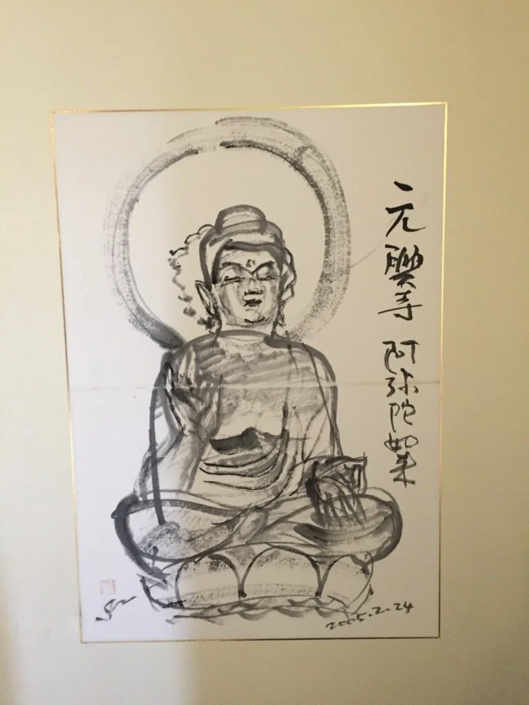 Black and white ink drawing of a seated, meditative figure with a halo, possibly a deity or spiritual figure, with Chinese or Japanese calligraphy to the right and a date at the bottom right.