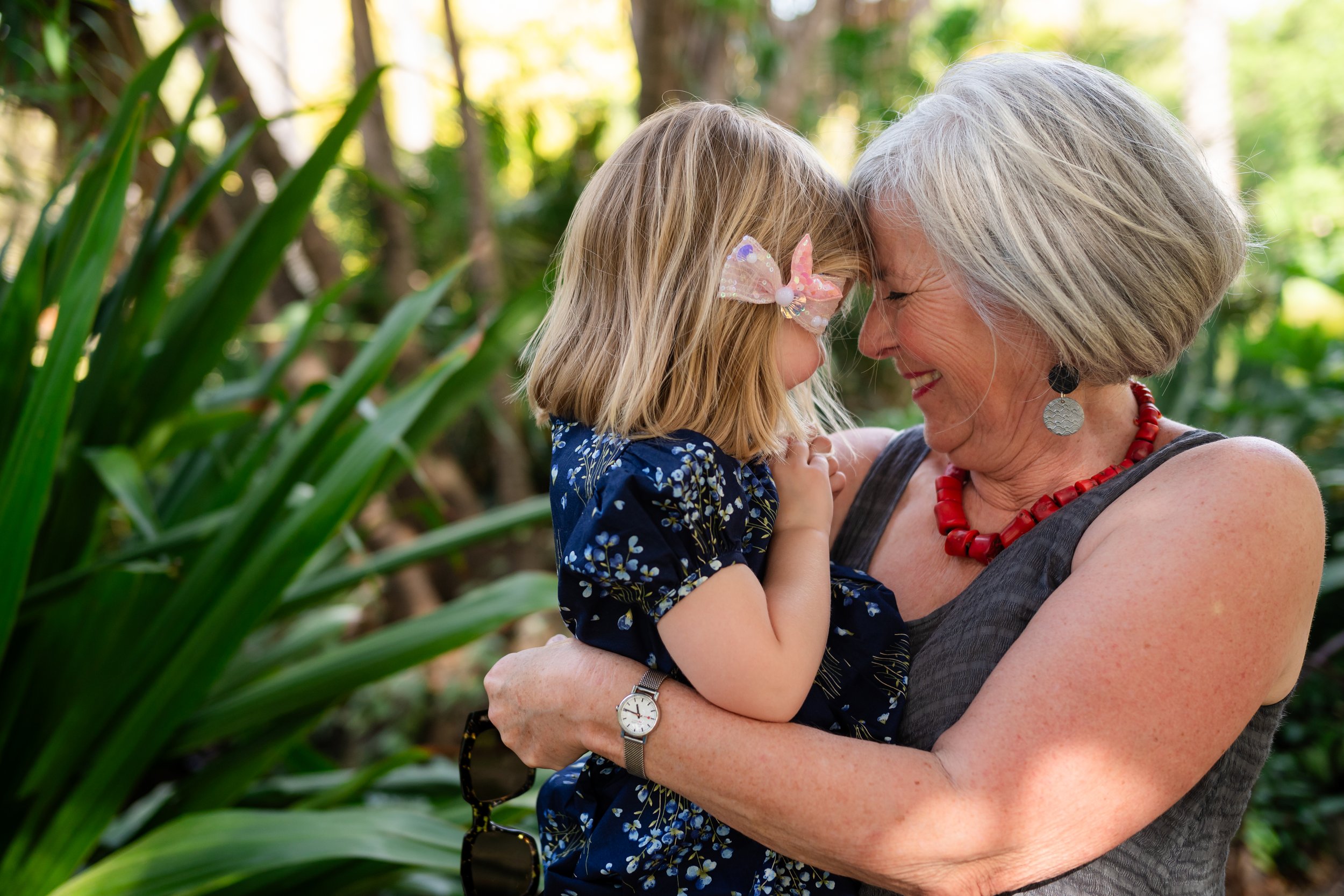 Grandma cuddling granddaughter