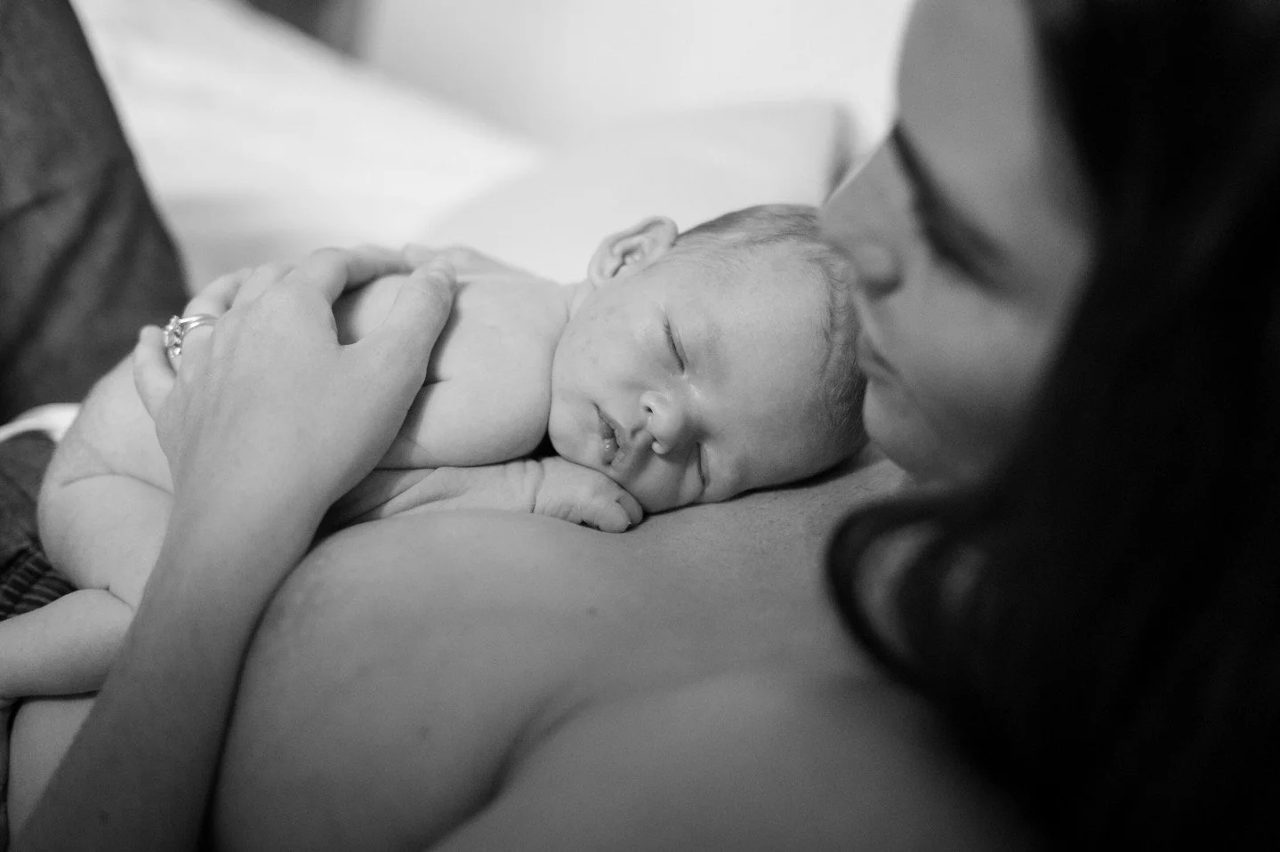 There&rsquo;s something about black and white newborn photography that I&rsquo;ll never get tired of.

Without colour, everything else becomes clearer.  The tiny fingers, the soft skin, the way a parent leans in close.

It feels quieter. More timeles