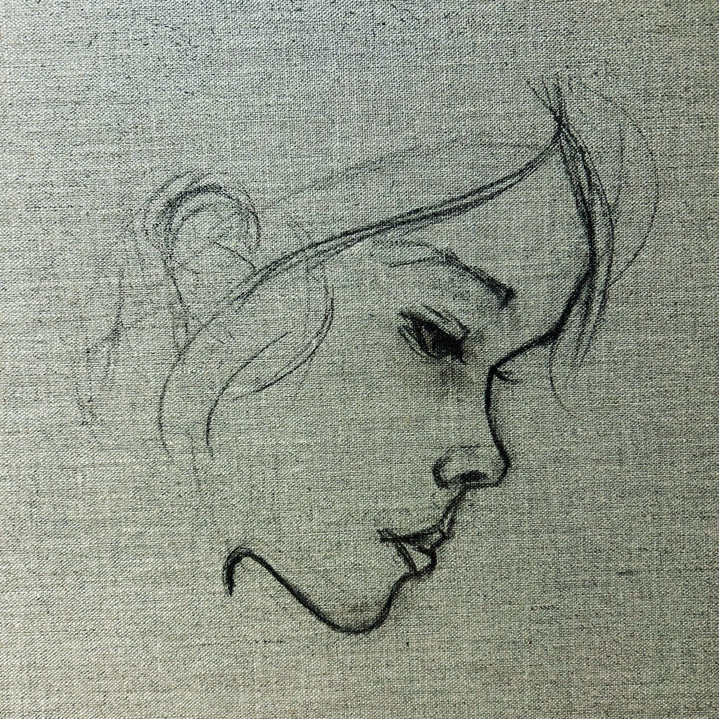 Hand-drawn sketch of an girl on gray textured fabric.