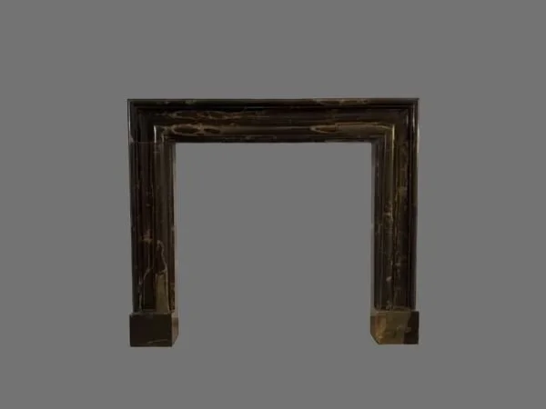 Bolection style fireplace in brown Portoro marble