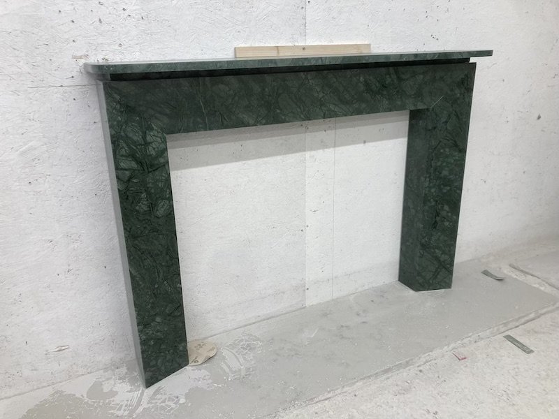 Architect designed.........

What does an Architect do when they are working on their own home? Design their own fireplace of course!

Here's a unique fire surround in a sumptuous Verde Guatamala green marble. Hand crafted by one of our skilled stone