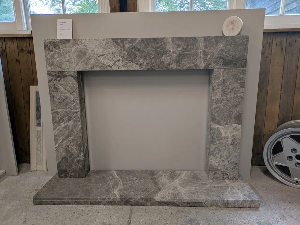 Another one.............

Lovely Douglas fireplace, handmade in a grey Emperador marble.
Measures 1320mm wide x 990mm high.
Was &pound;1538, now &pound;999 with a free hearth worth &pound;487
You save &pound;1000+