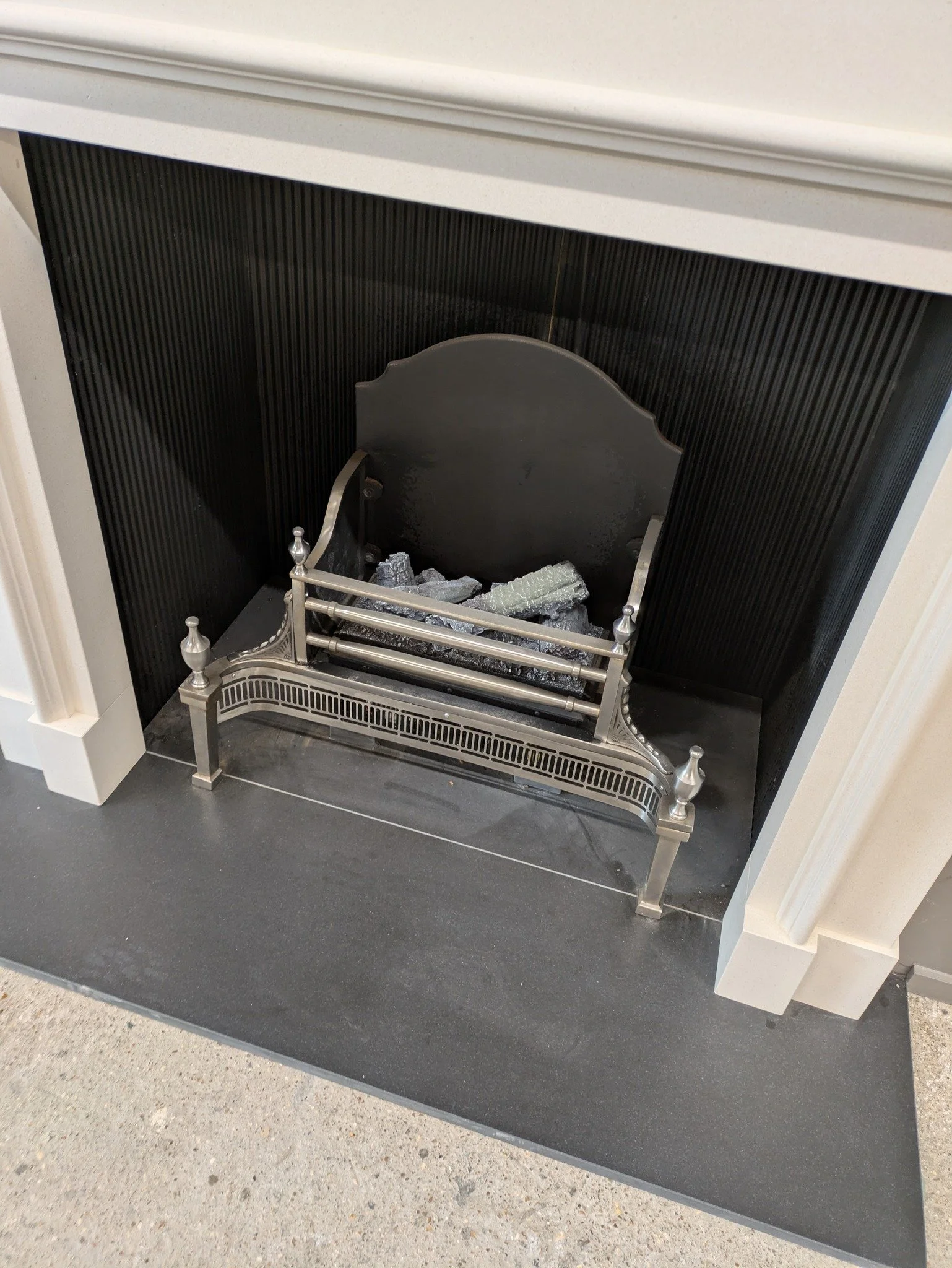 Fire baskets, hearths and interiors.........

Don't forget we can supply everything you need to complete your new fireplace installation. Here we have a granite hearth, a set of reeded cast iron interior panels and a Cowdray fire basket, featuring a 