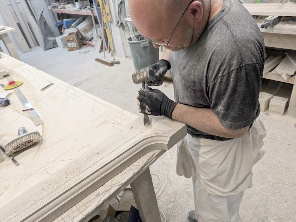 Hammer and chisel.................and a lot of skill

Yesterday we showed Ian standing next to a rather splendid hand-carved Portland stone Windsor fireplace he had made. What we didn't mention was the huge amount of skill and years of experience it 