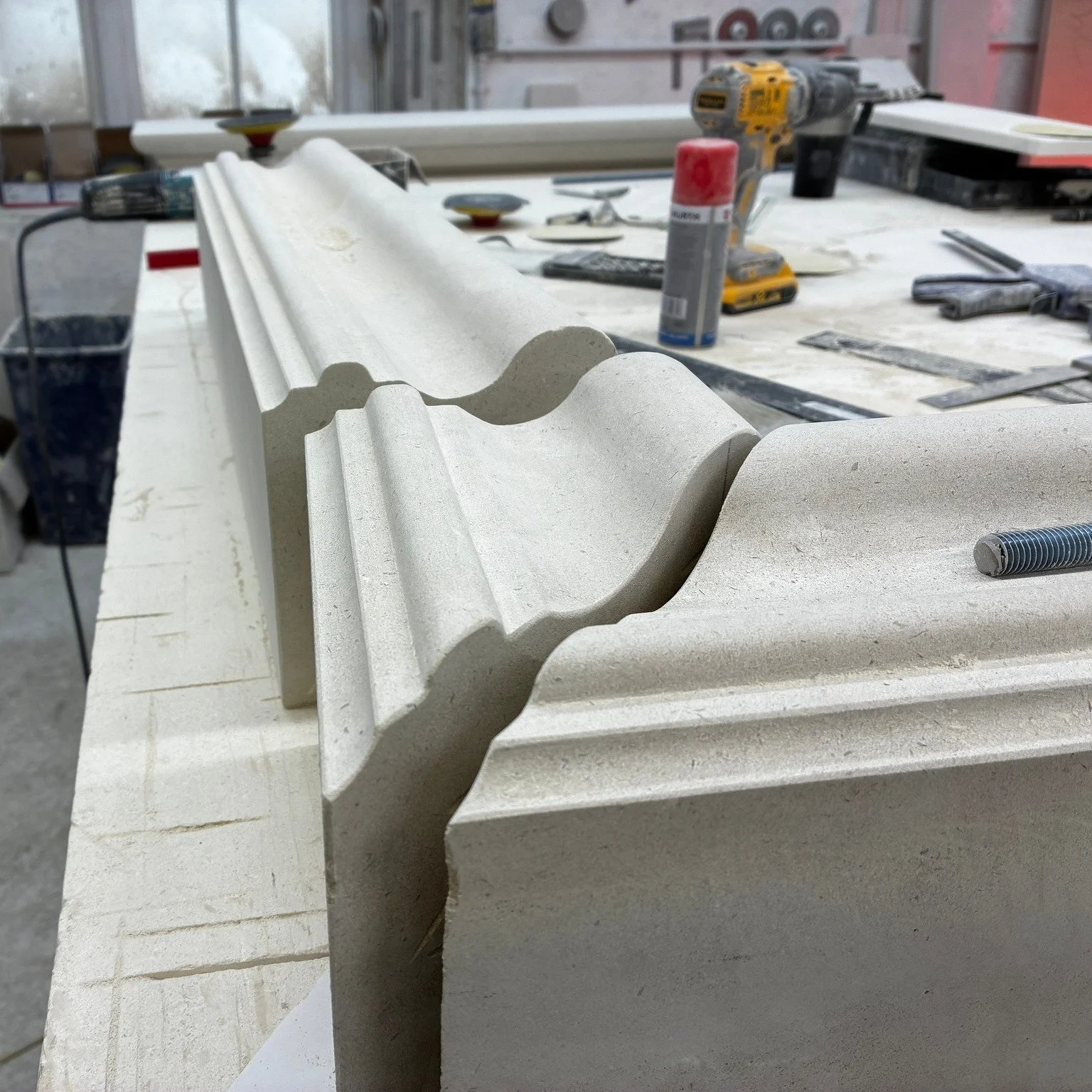 Portland part 2.........

The blocks are now up on the bench after being cut on the saw. Matt one of our amazing stone masons has carefully hand-finished the profile and is about to make sure everything lines up. Fireplaces handcrafted in the finest 