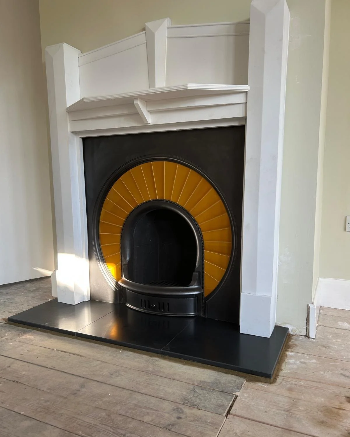 Simply stunning.............

Glen our amazing fireplace fitter has just finished this stunning install. Featuring a reclaimed and restored cast iron insert with an amazing tiled sunburst, and a hand-painted timber surround.

so Art Deco............
