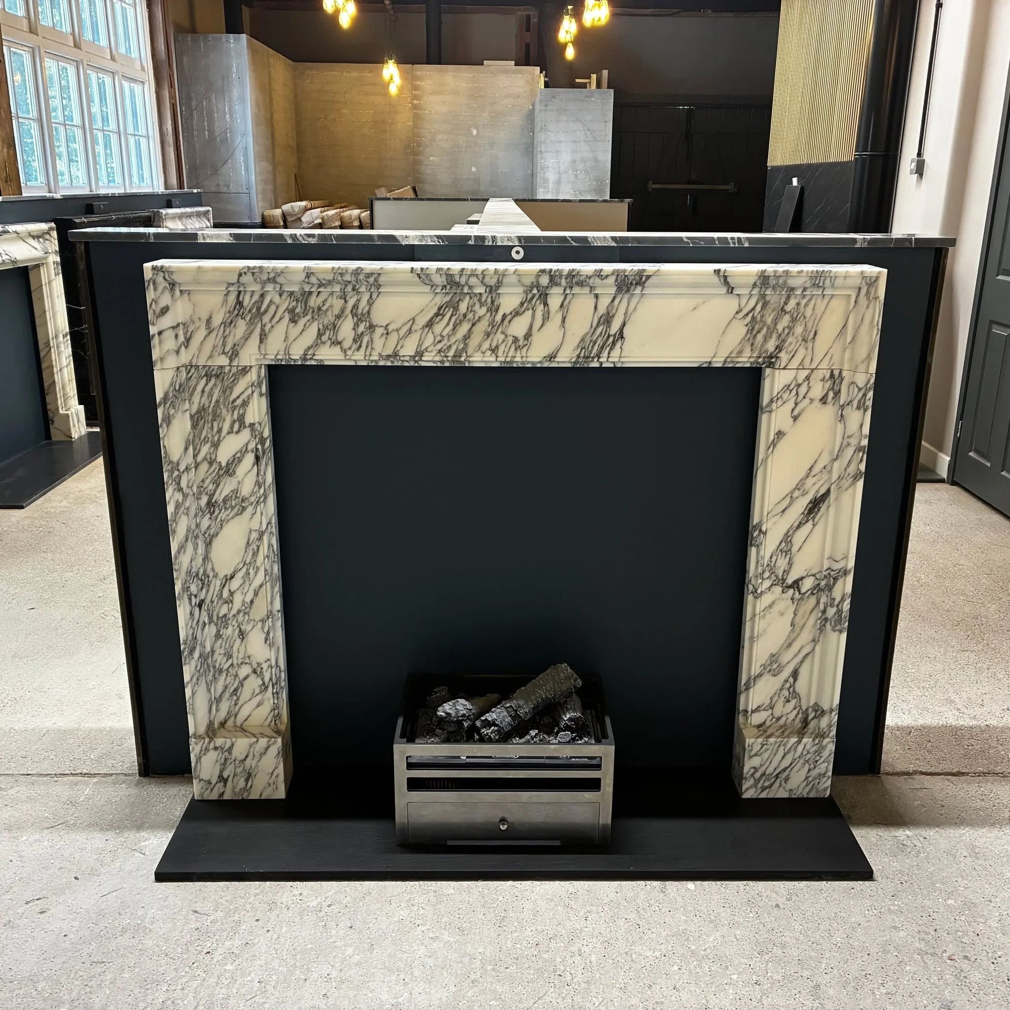 New addition......

Just added to our showroom display is this rather lovely Classic Camber fireplace in a striking Italian Arabescato marble.

#fireplaceshowroom🔥#fireplace🔥 #fireplacedesign #arabescatomarble #italianmarble #homedesign #Architectu