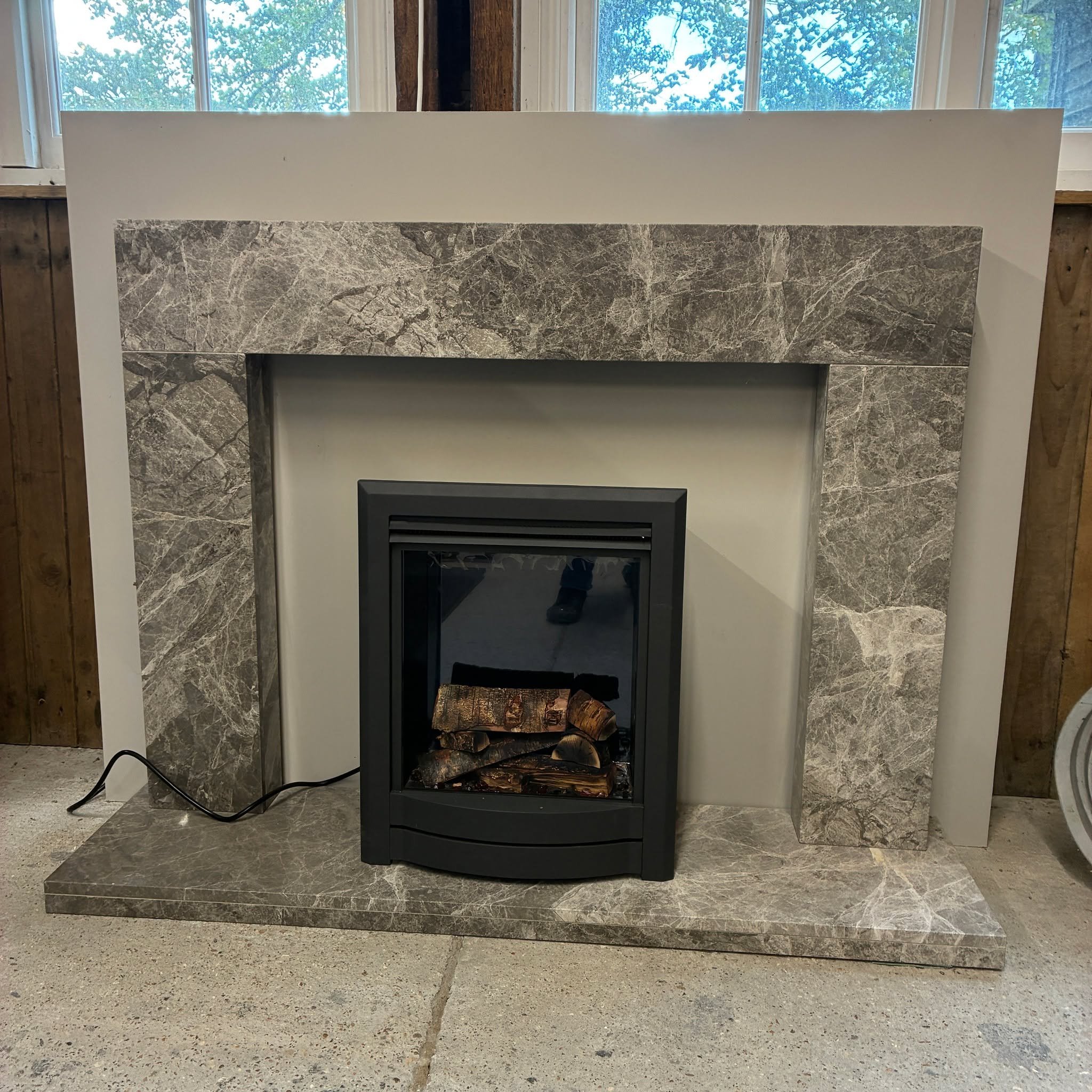 LAST ONE.......

To make way for some new displays in our Arundel showroom, we need to clear a few ex-display fireplaces at unbeatable prices.........

Here's a lovely Douglas fireplace, handmade in Grey Emperador marble....including a matching heart
