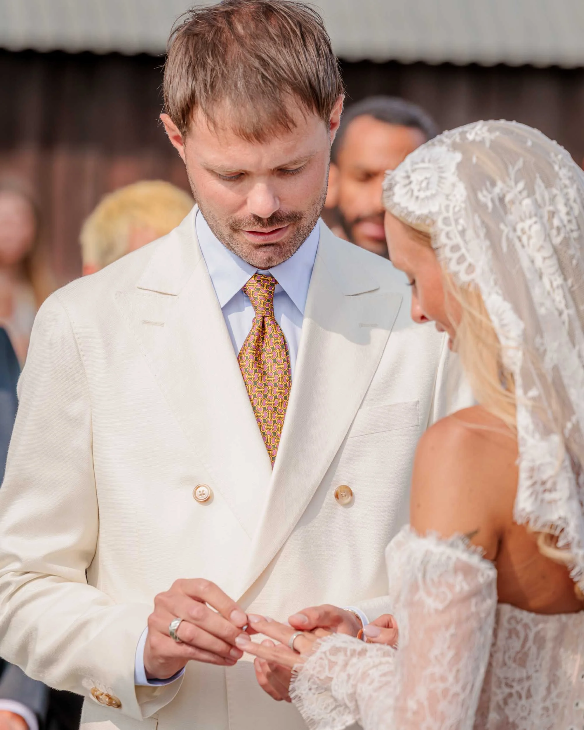 Close-up of the exchange of rings during a wedding ceremony, a candid wedding photo capturing the moment