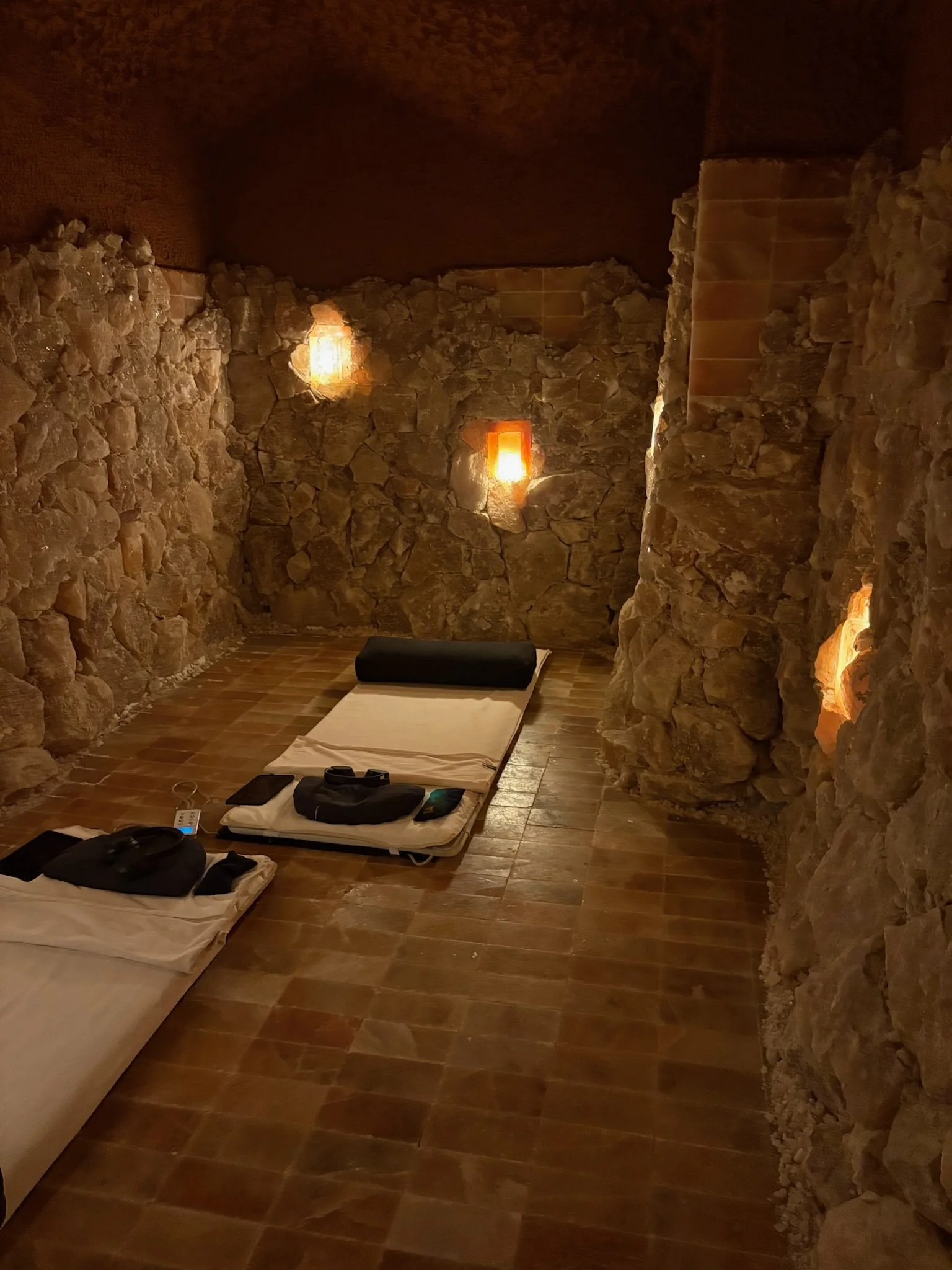 A light mattress on the floor for halotherapy inside of Save Cave Therapy