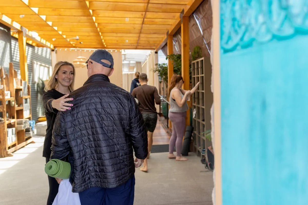 Guests arrive and check in at Yoga Deck's entrance before class.
