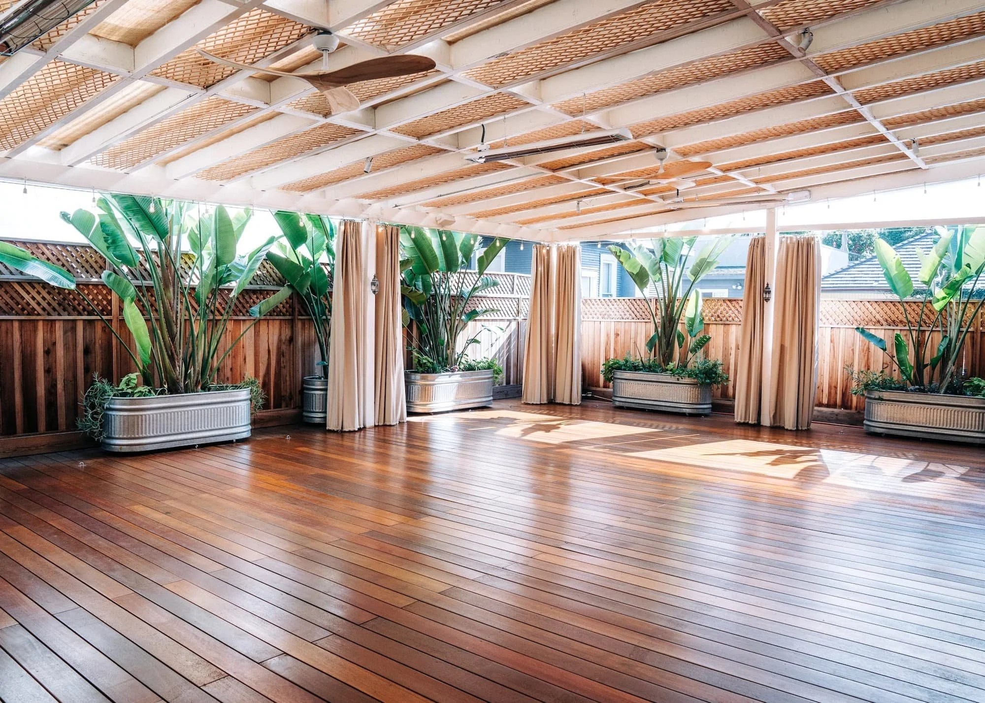 the studio's covered outdoor deck with plants.