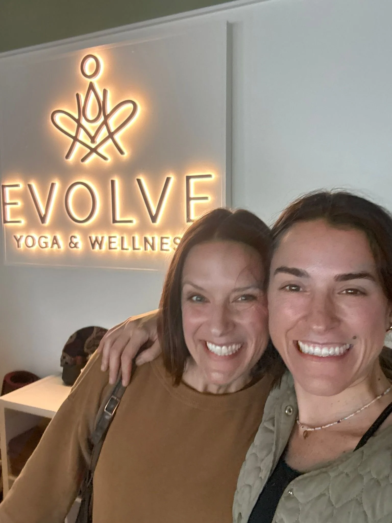 Telomere's COO & CEO at the front desk of Evolve Yoga, in West Palm Beach