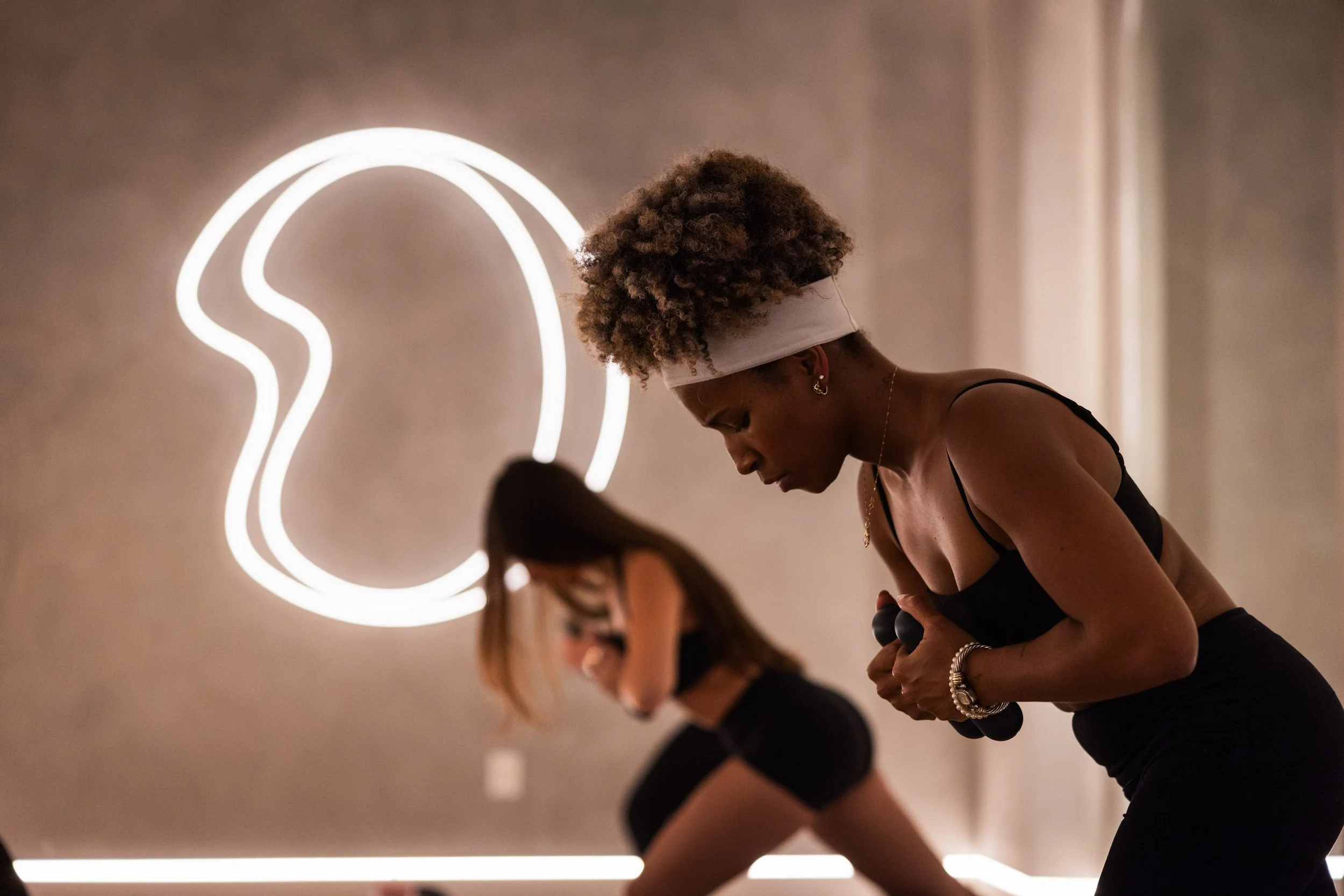 Classic Pilates class with dumbbells