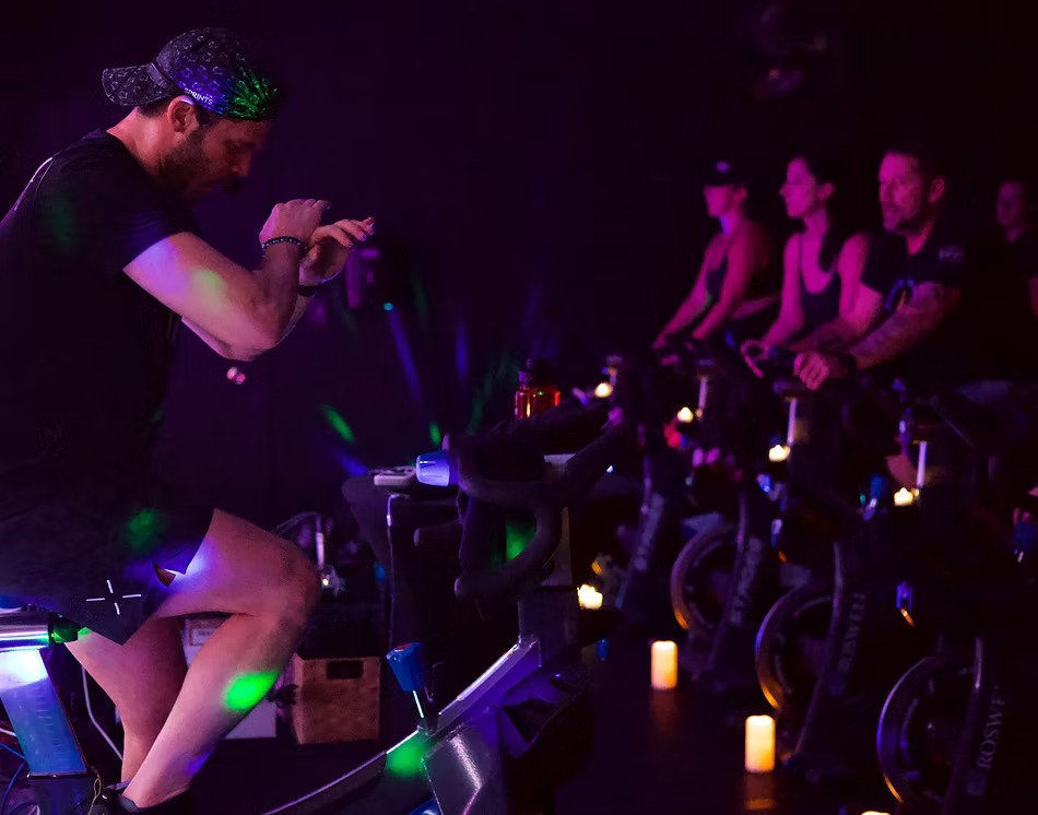 An indoor cycling class in Spark Fitness