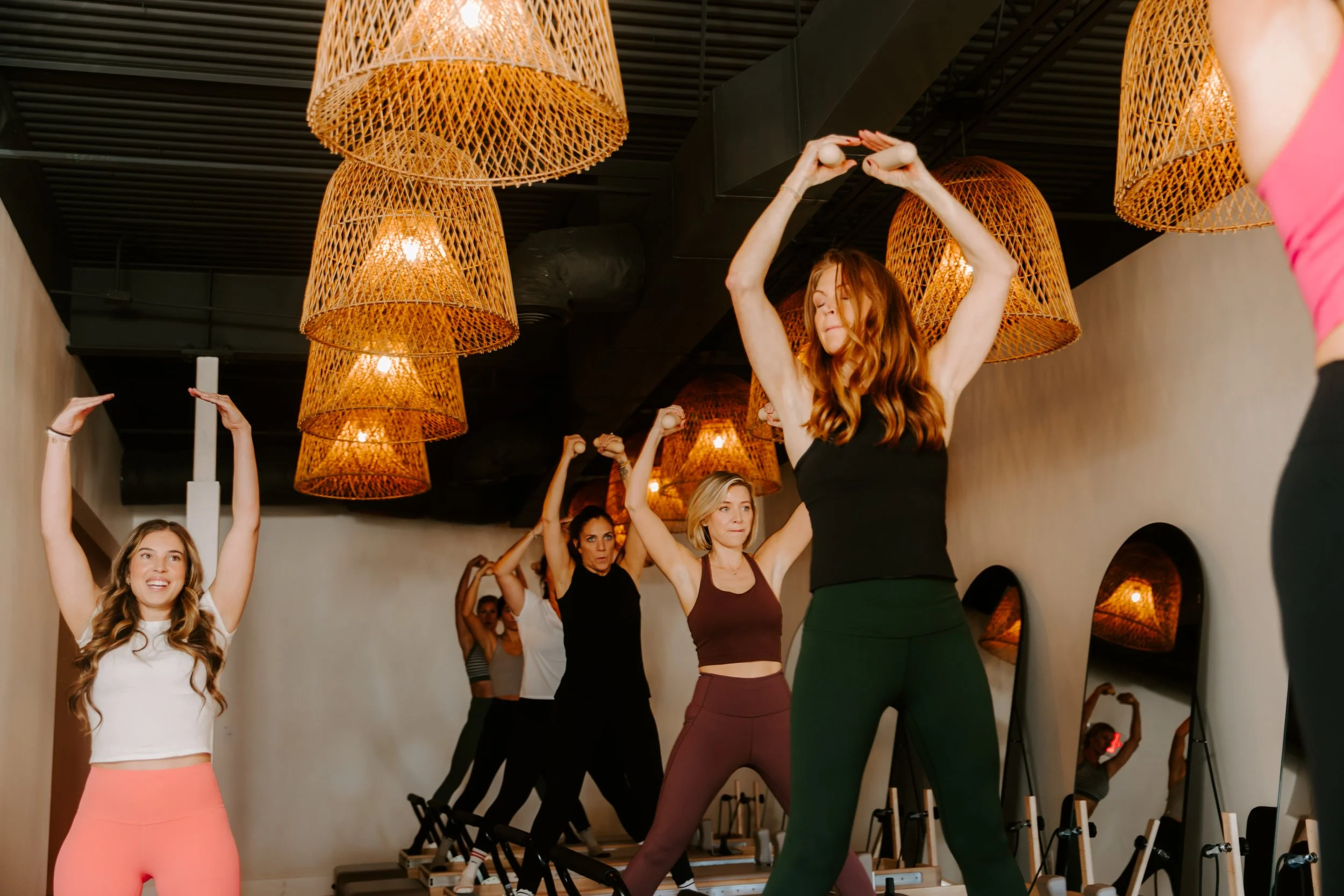 A group Pilates class in a boutique studio
