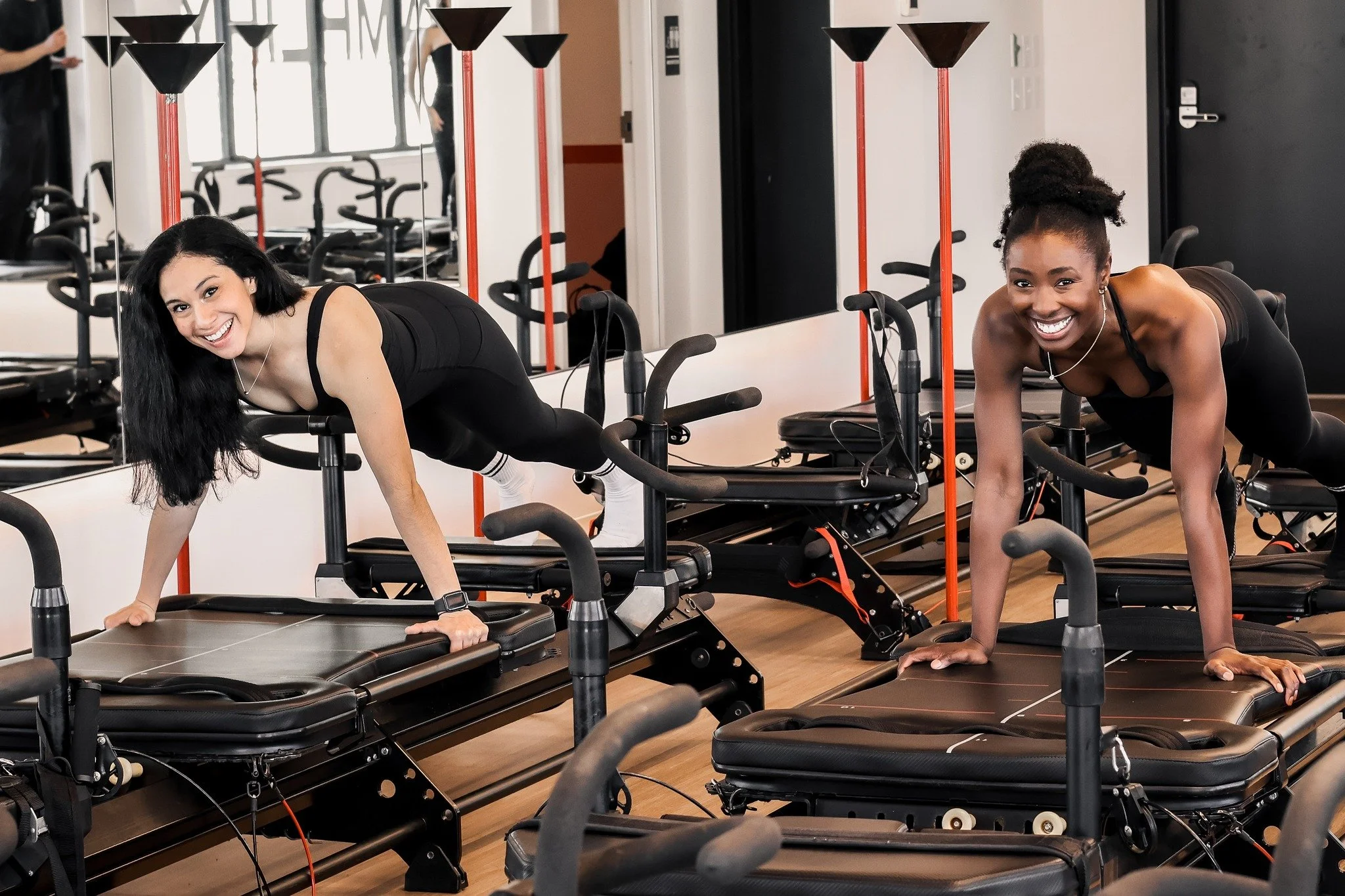 Two woman instructors doing Lagree